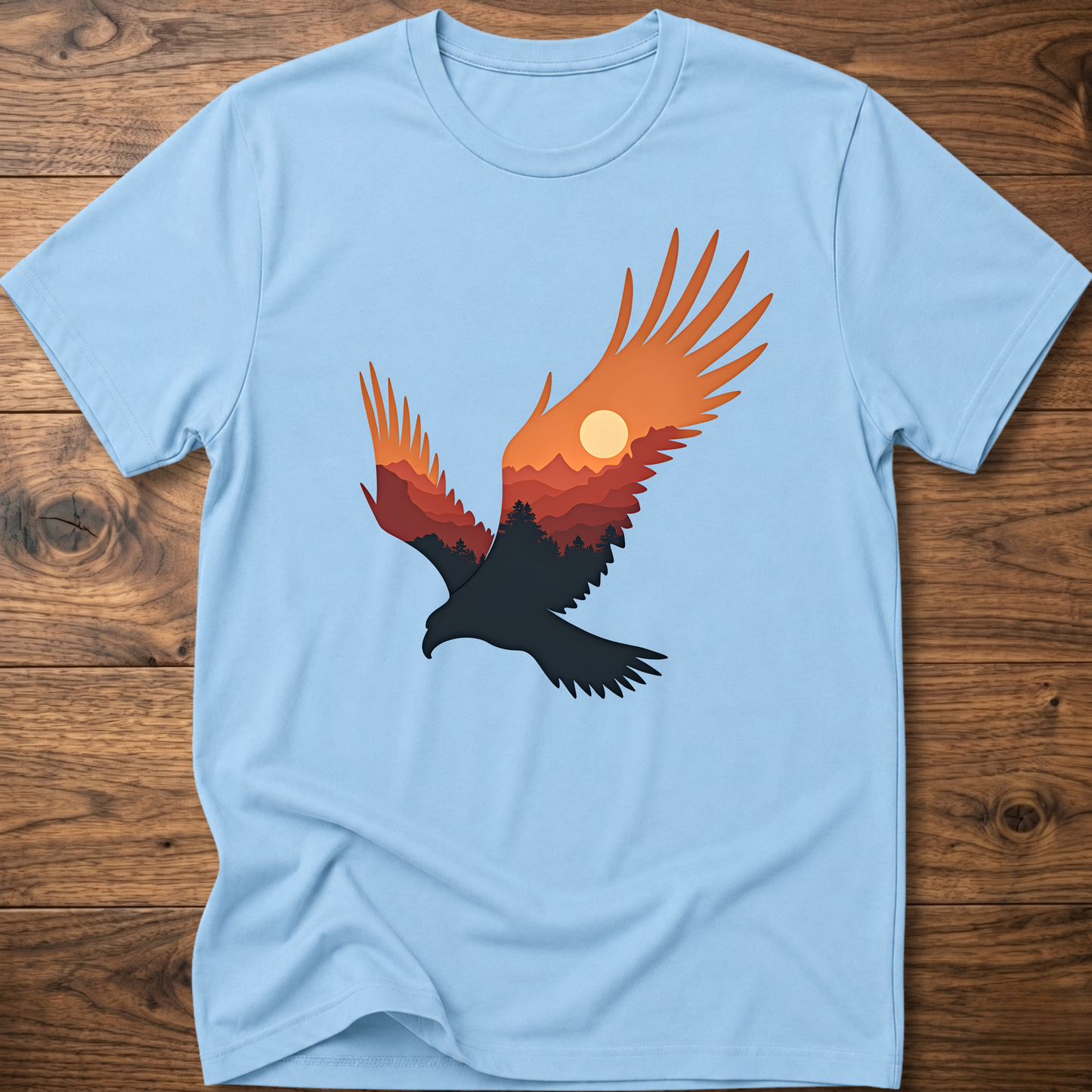 Light blue crew-neck t-shirt with colorful eagle and moon graphic on chest
