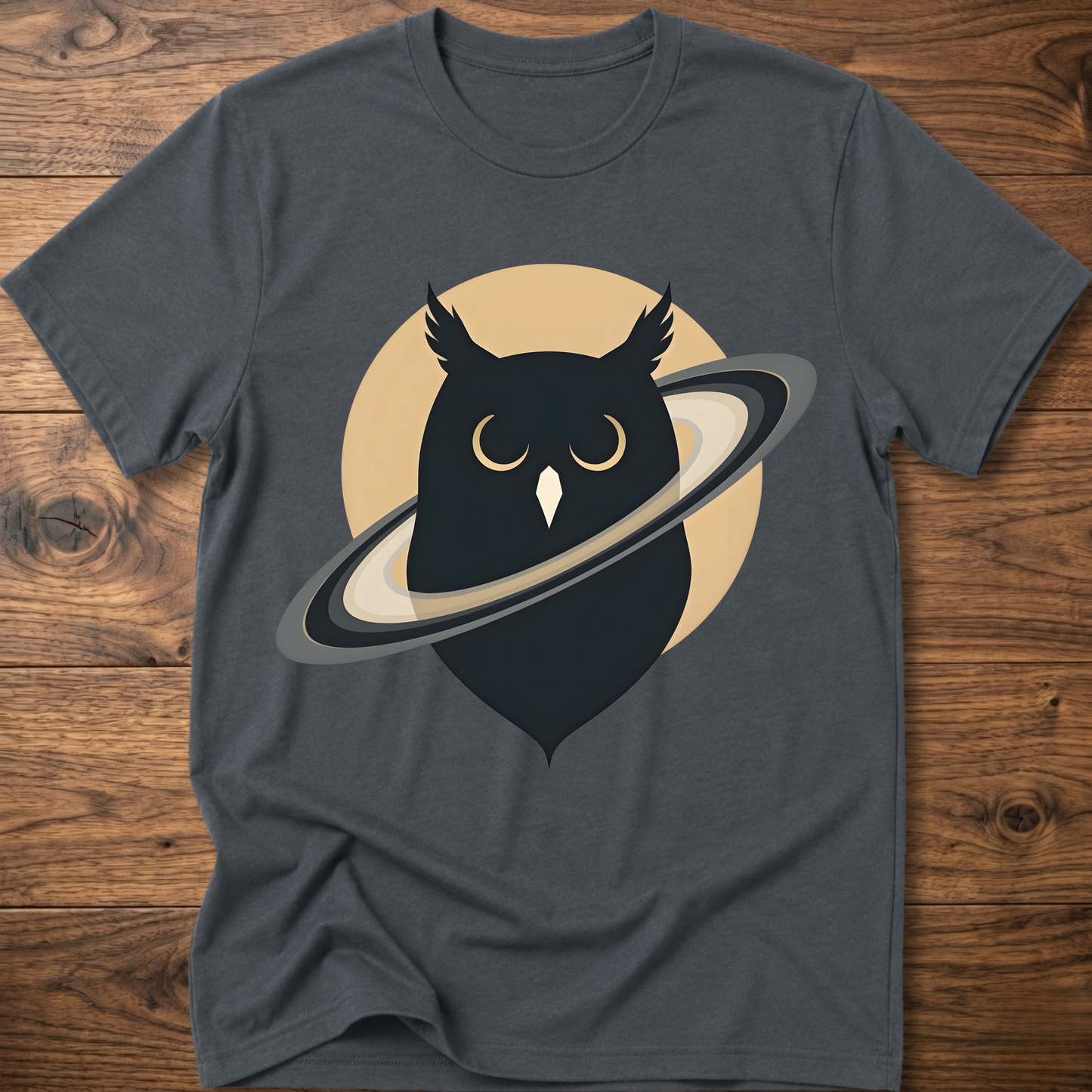 Dark gray t-shirt with black owl and planet graphic on the front