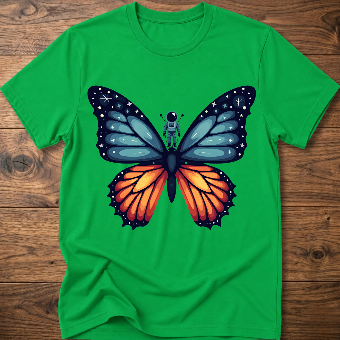 Green crew-neck t-shirt with blue-and-orange butterfly astronaut graphic