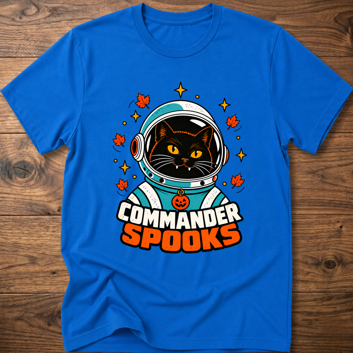 Royal blue crew-neck T-shirt with cat astronaut graphic and Halloween leaves.