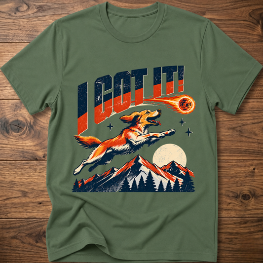 Military green T-shirt with 'I GOT IT' retro dog graphic and sunset mountains