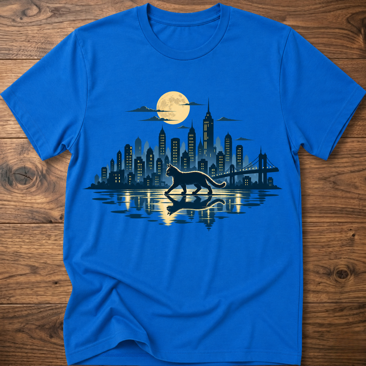 Royal blue short-sleeve T-shirt with cat and city skyline graphic at center