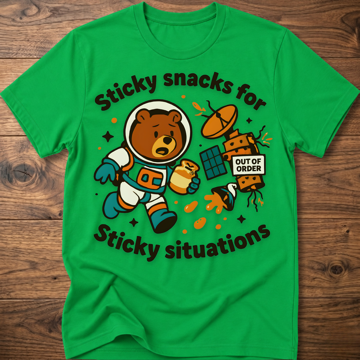 Green bear graphic t-shirt with cartoon snack scene and 'Out of Order' badge