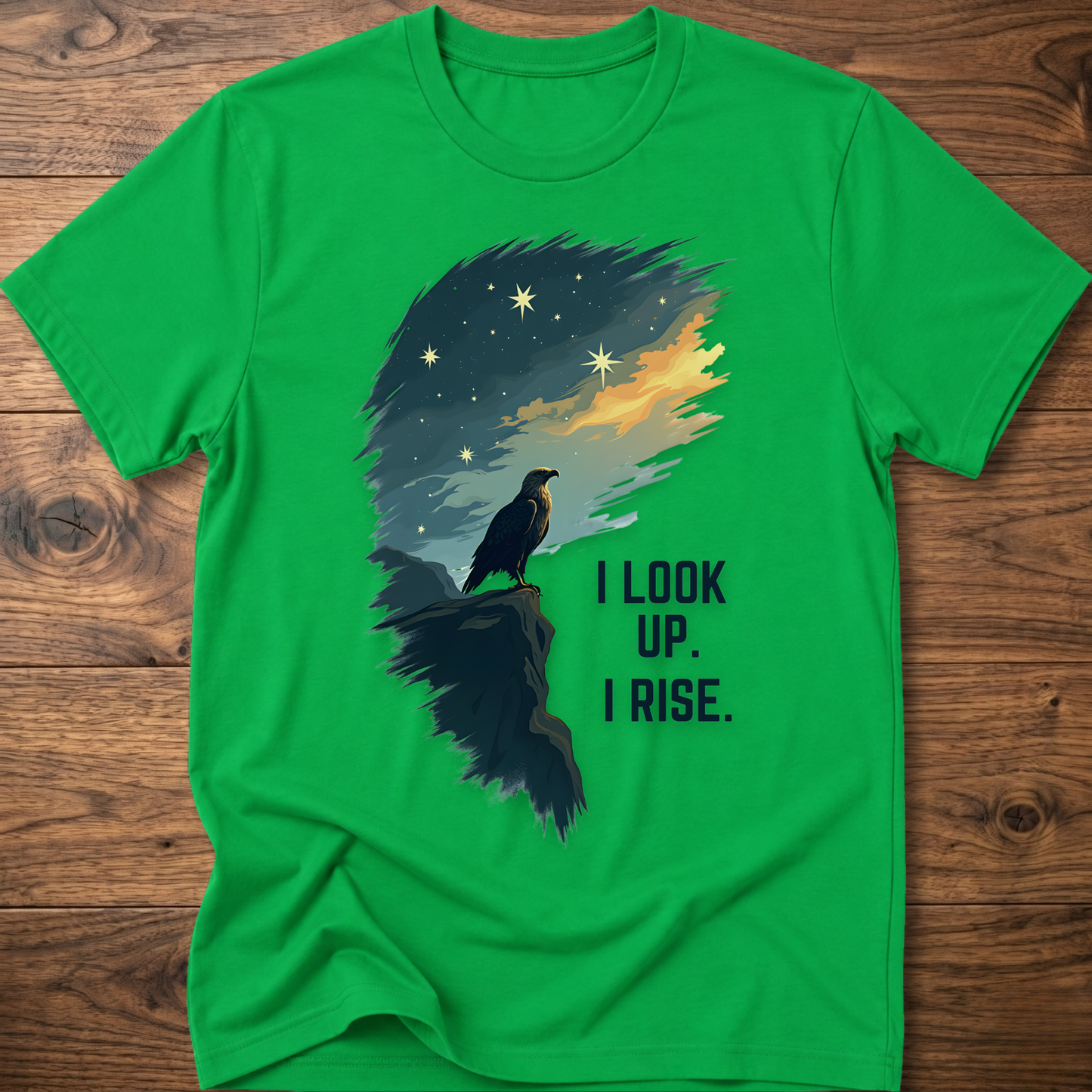 Green T-shirt with raven sunrise graphic and 'I LOOK UP. I RISE.'