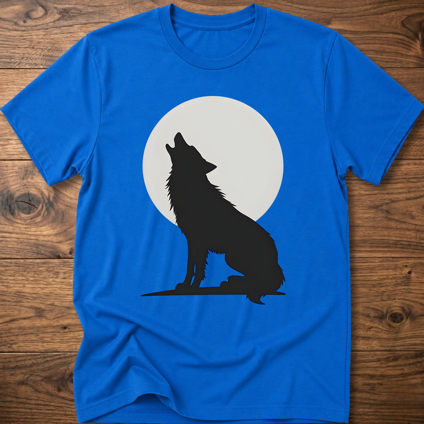 Royal blue graphic wolf T-shirt with black wolf silhouette and white moon circle print.