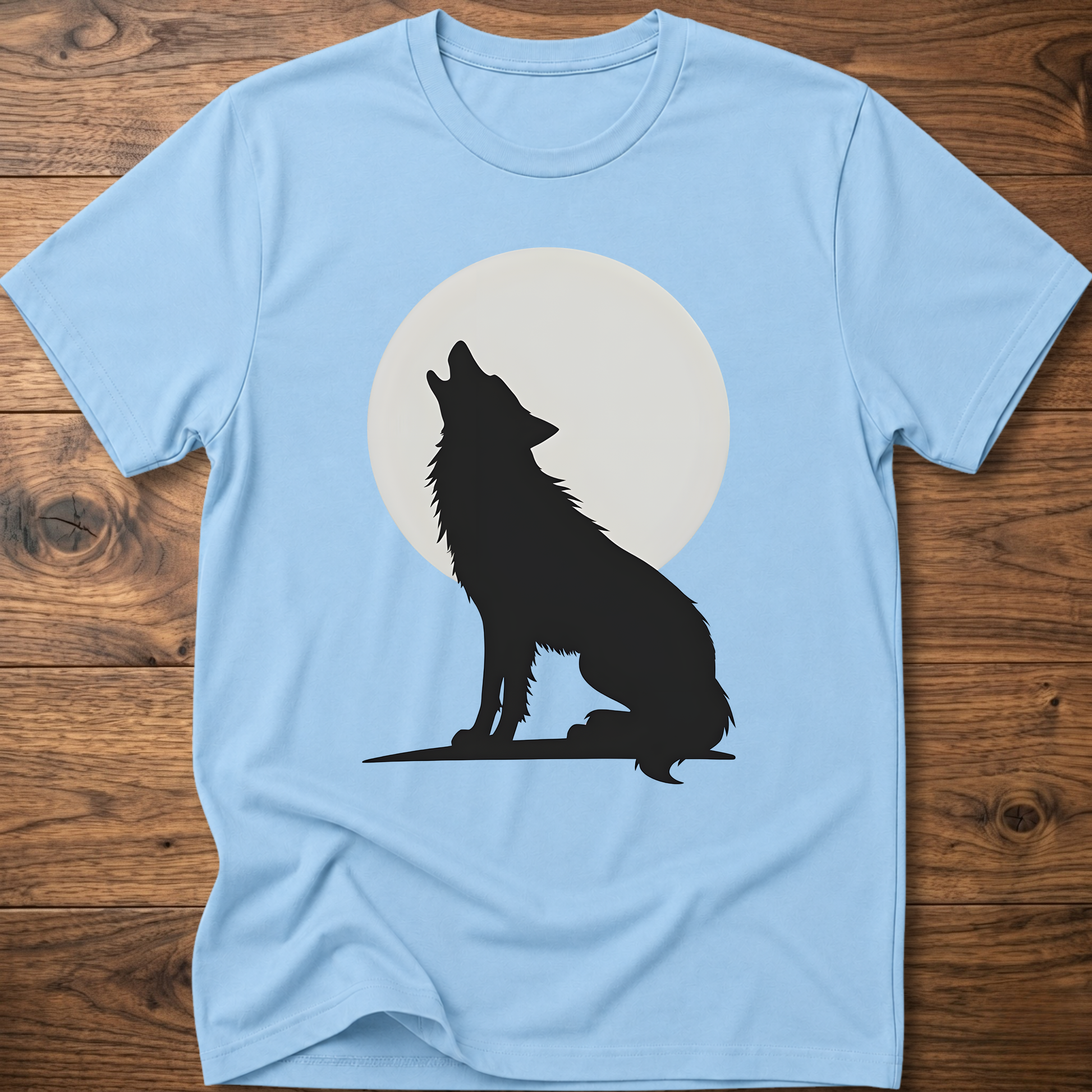 Light blue graphic wolf T-shirt with black wolf silhouette and white moon circle print.