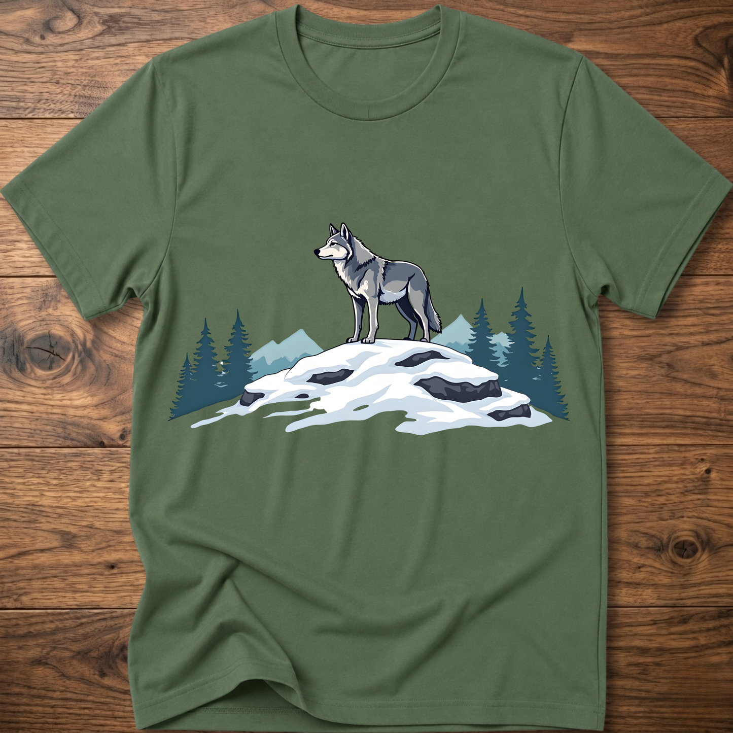 Military green t-shirt with standing wolf graphic over snowy rocks and pine trees