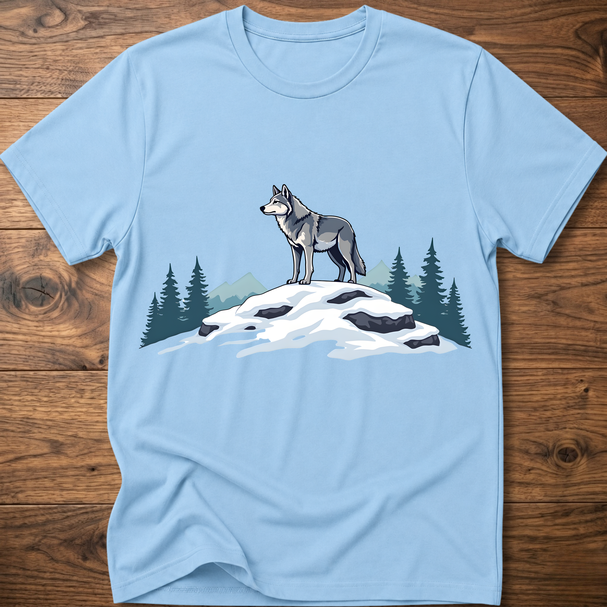 Light blue t-shirt with standing wolf graphic over snowy rocks and pine trees