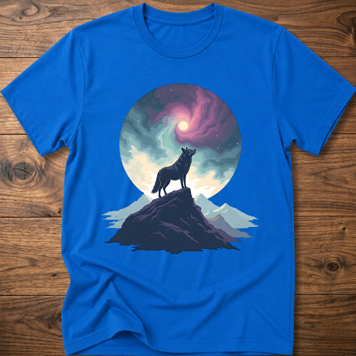 Blue graphic t-shirt featuring a wolf silhouette on mountain under glowing moon