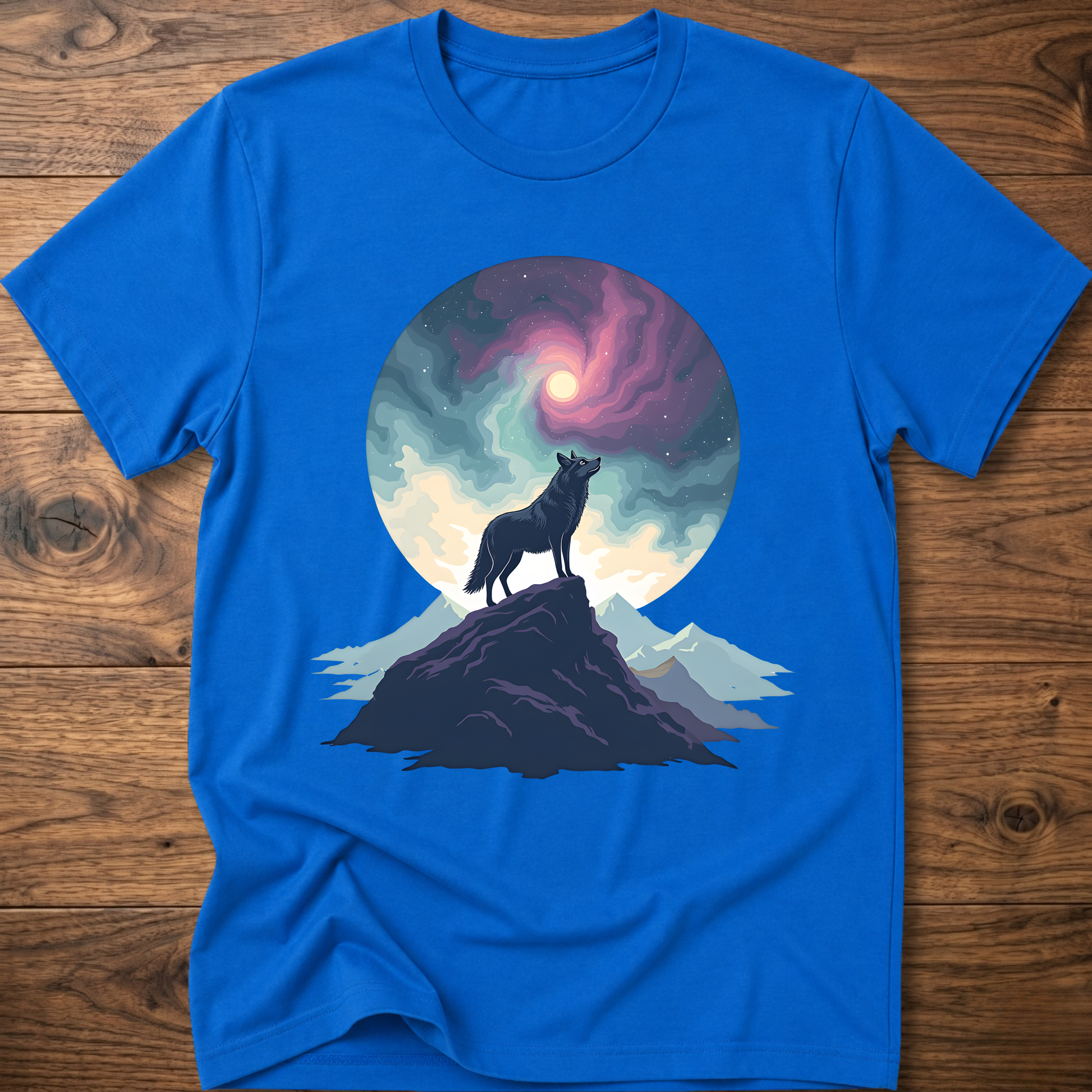 Blue graphic t-shirt featuring a wolf silhouette on mountain under glowing moon