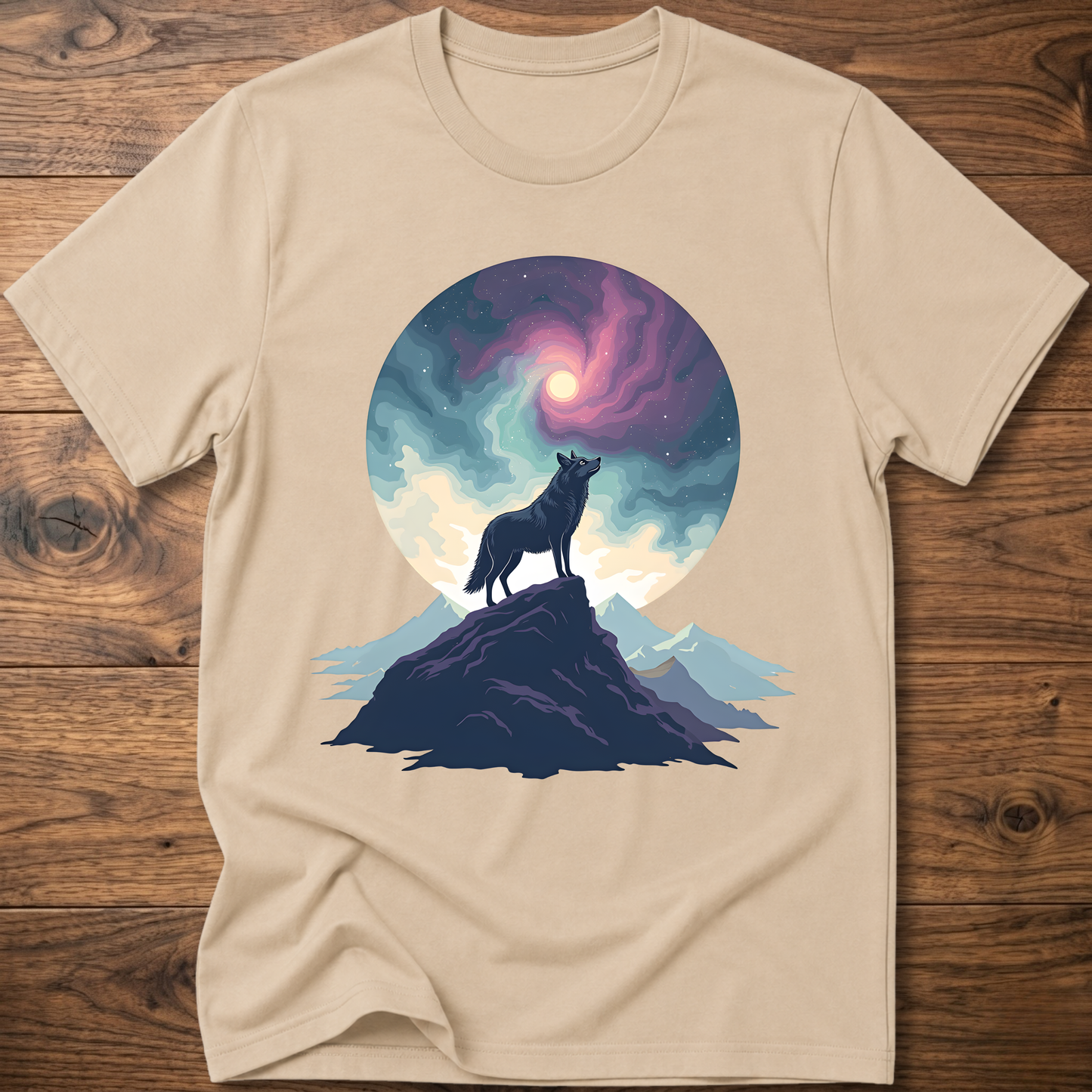 Sand graphic t-shirt with wolf silhouette on mountain under a colorful moon circle