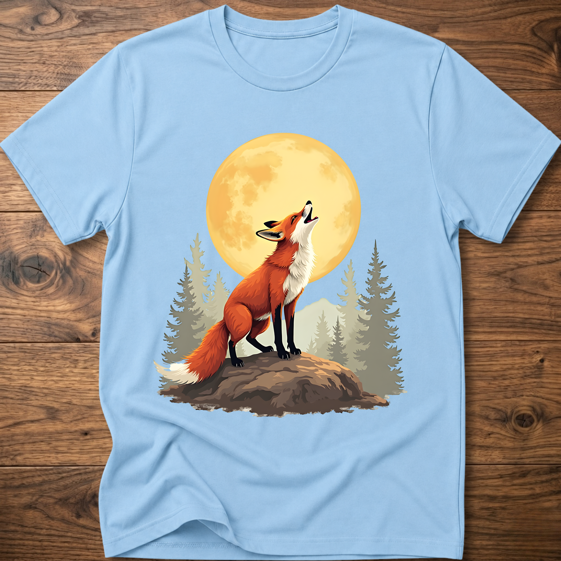 Light blue t-shirt with retro fox graphic under a golden moon and pine trees