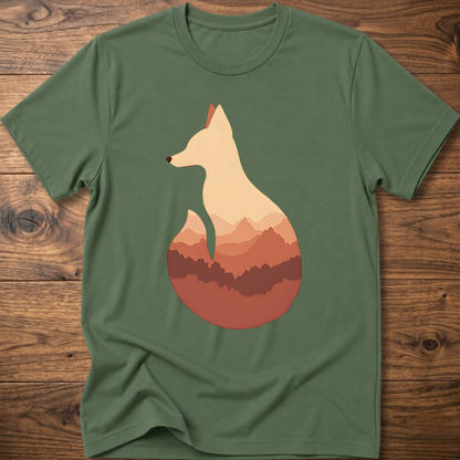 Military green t-shirt with cream fox silhouette graphic over sunset mountains
