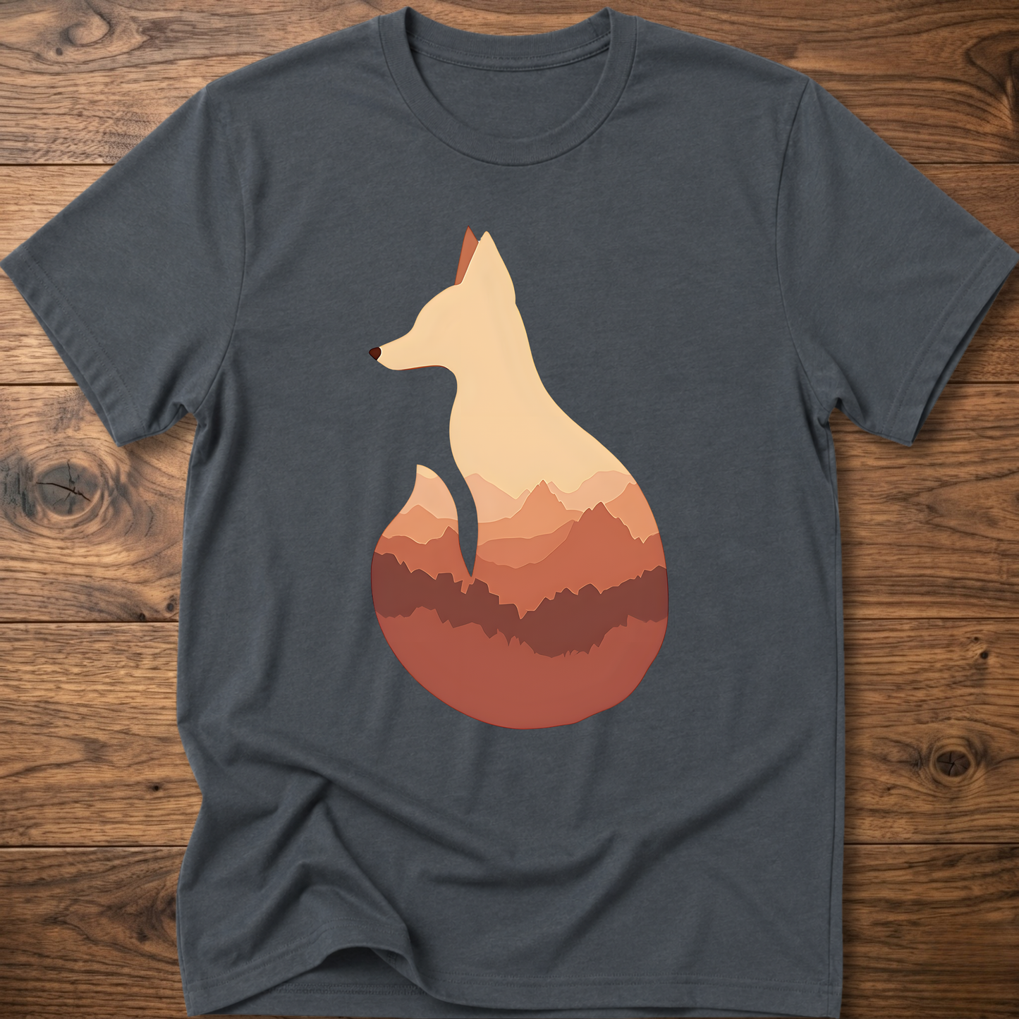 Dark heather gray t-shirt with cream fox silhouette graphic over sunset mountains