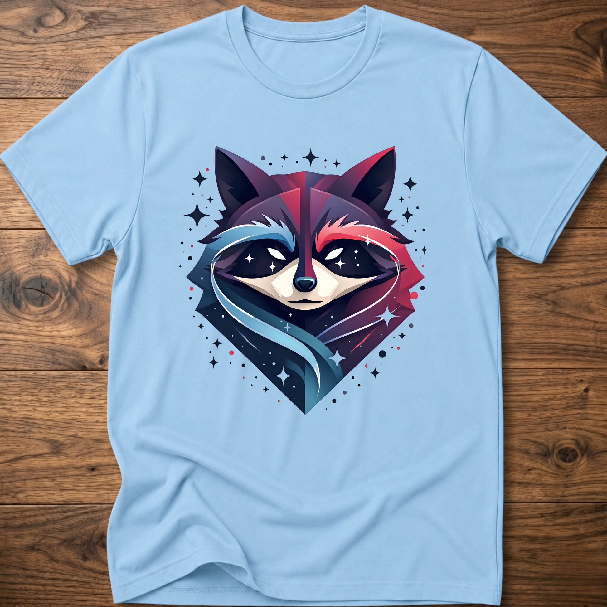 Light blue T-shirt with starry raccoon head graphic and sparkly star accents