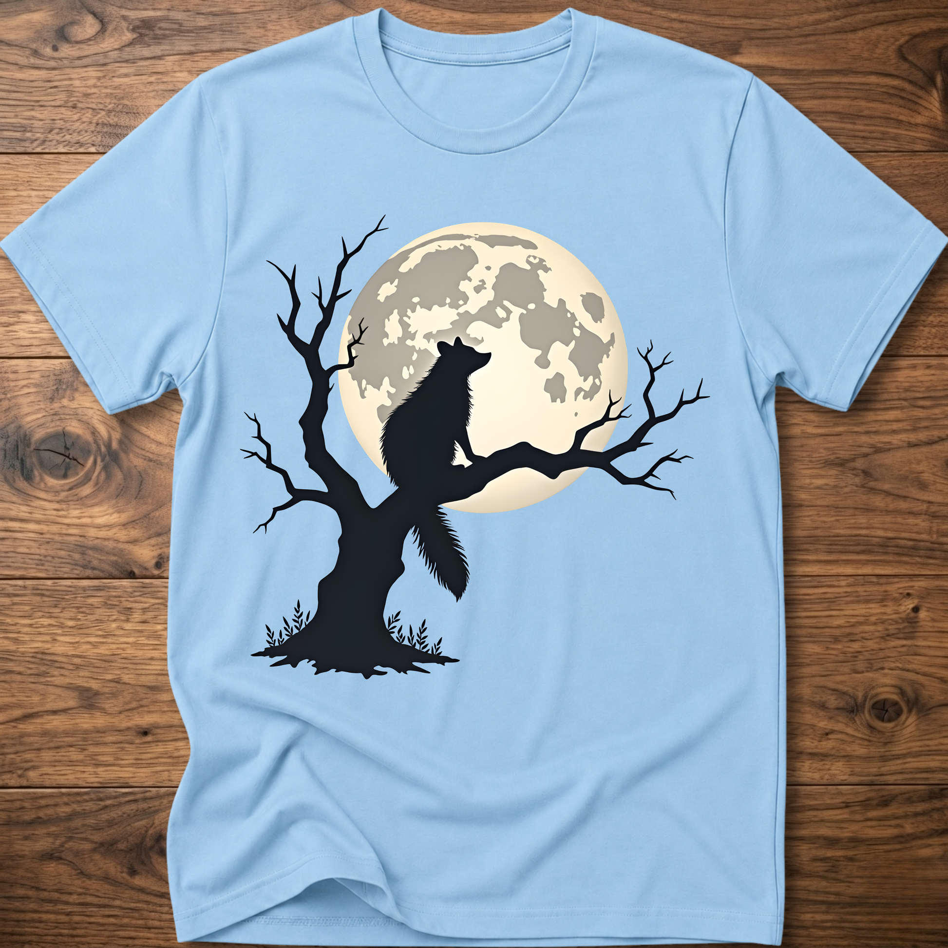 Light blue t-shirt with full moon raccoon and tree silhouette graphic
