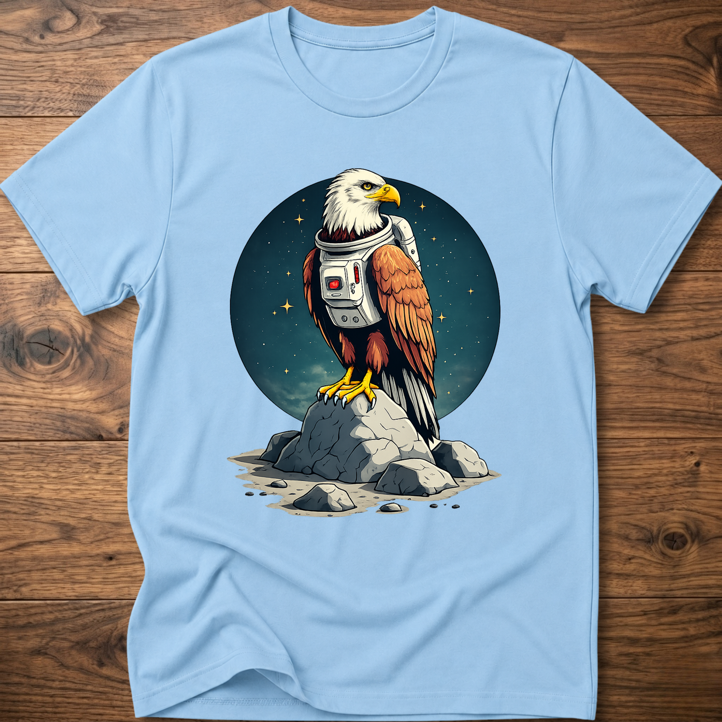 Light blue T-shirt with astronaut-eagle graphic on dark circular space emblem