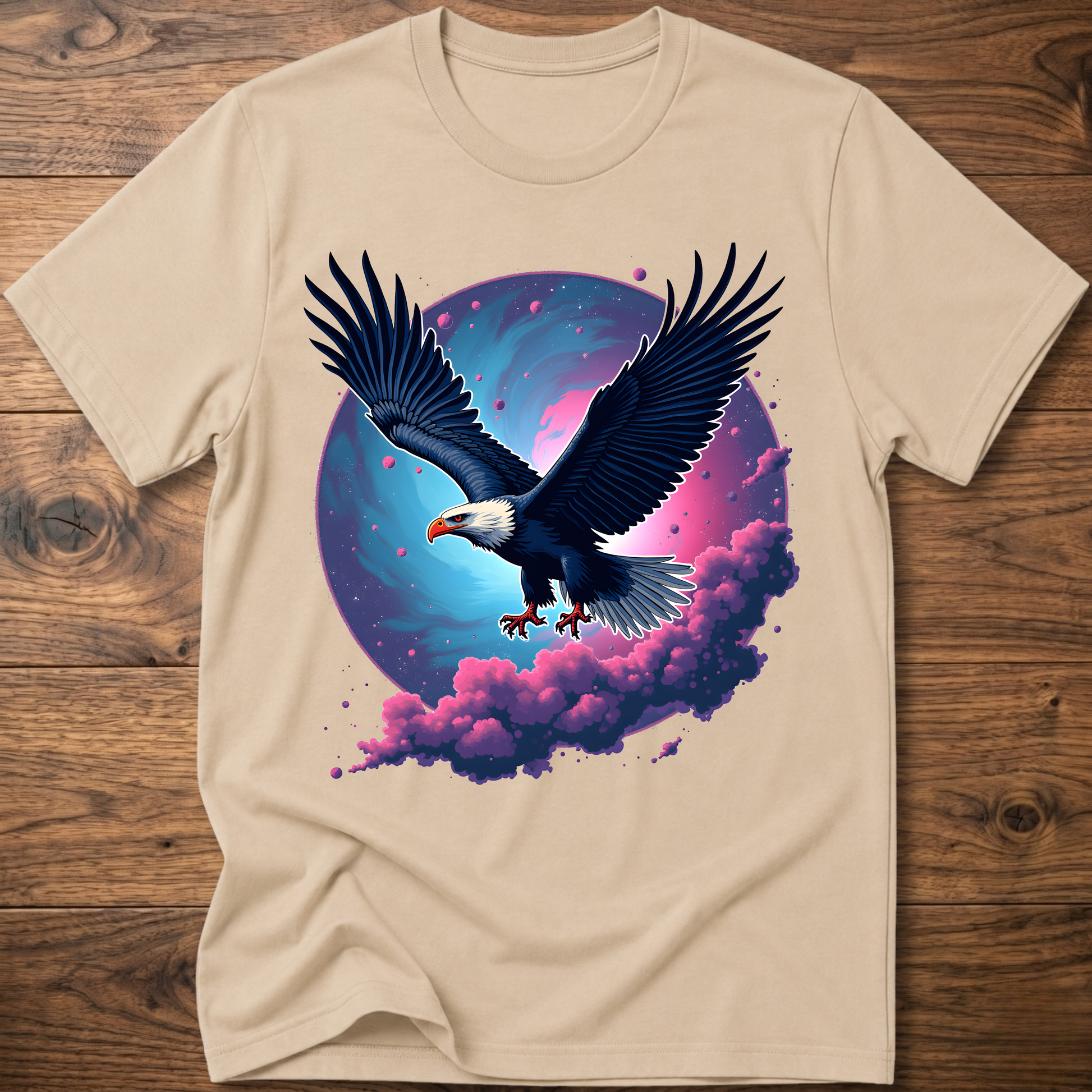 Sand-colored eagle T-shirt with galaxy wing art and pink-purple clouds on front