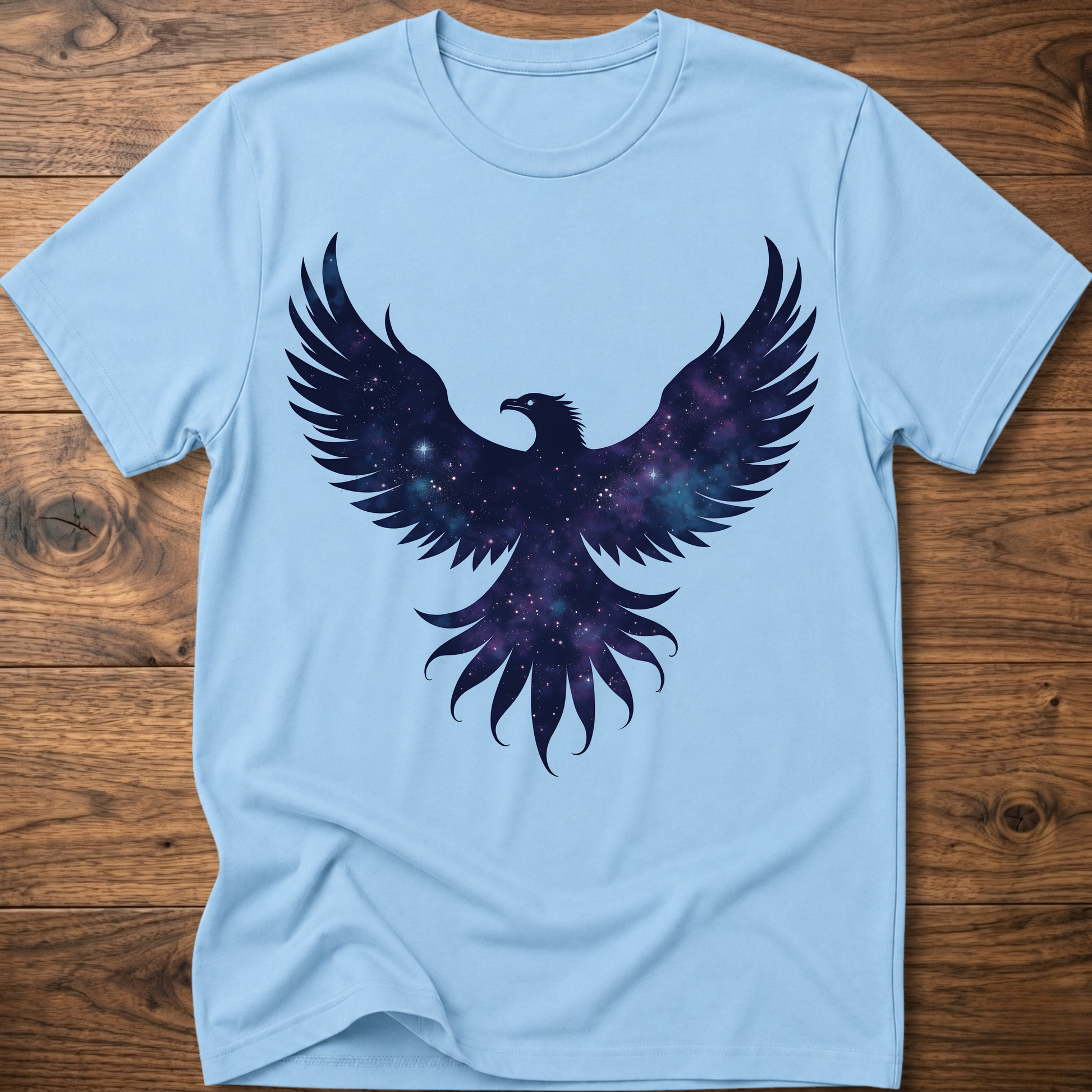 Light blue crew-neck T-shirt with galaxy eagle and winged emblem graphic