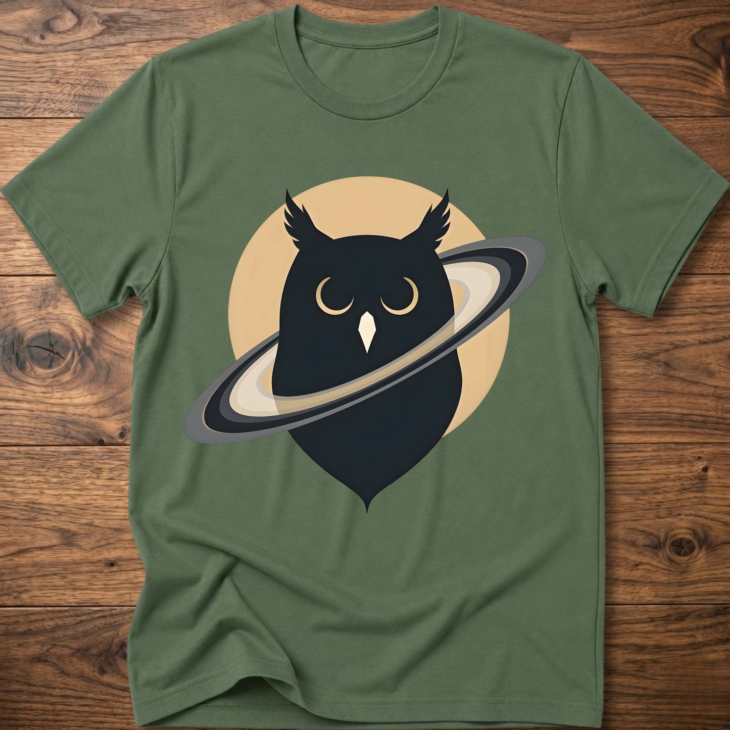 Green t-shirt with black owl and planet graphic on the front