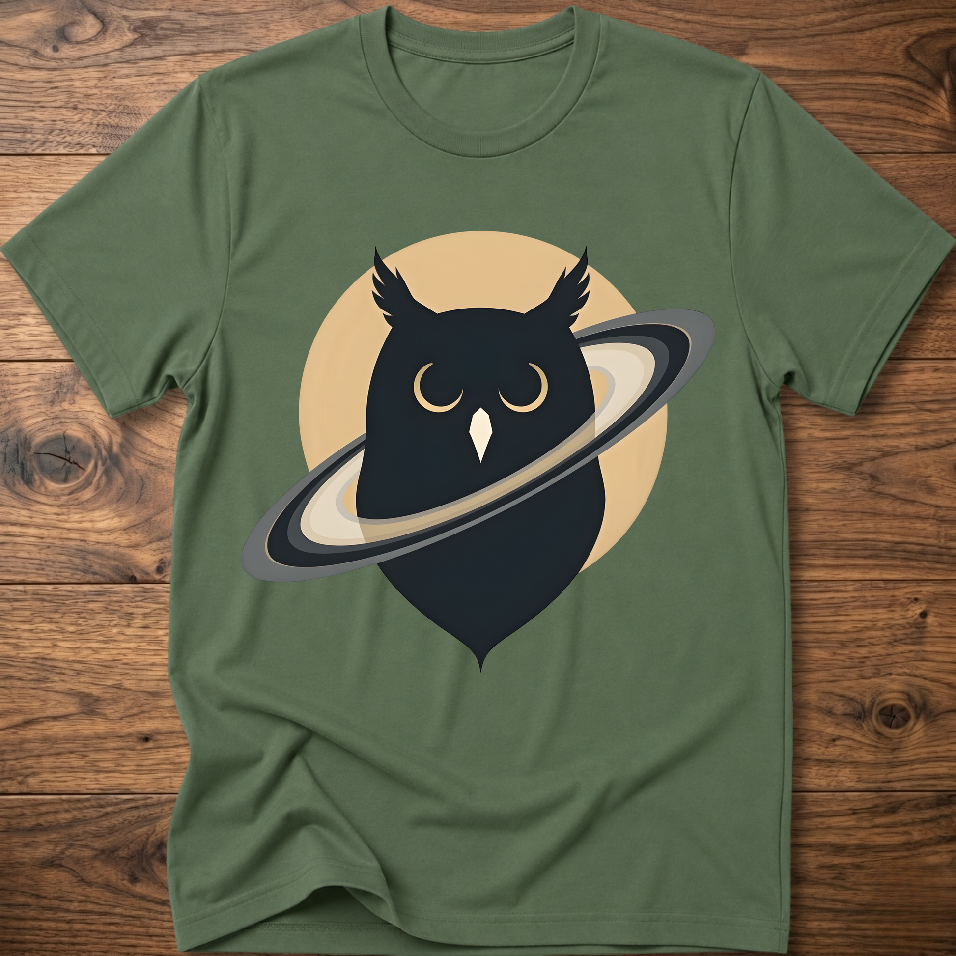 Green t-shirt with black owl and planet graphic on the front