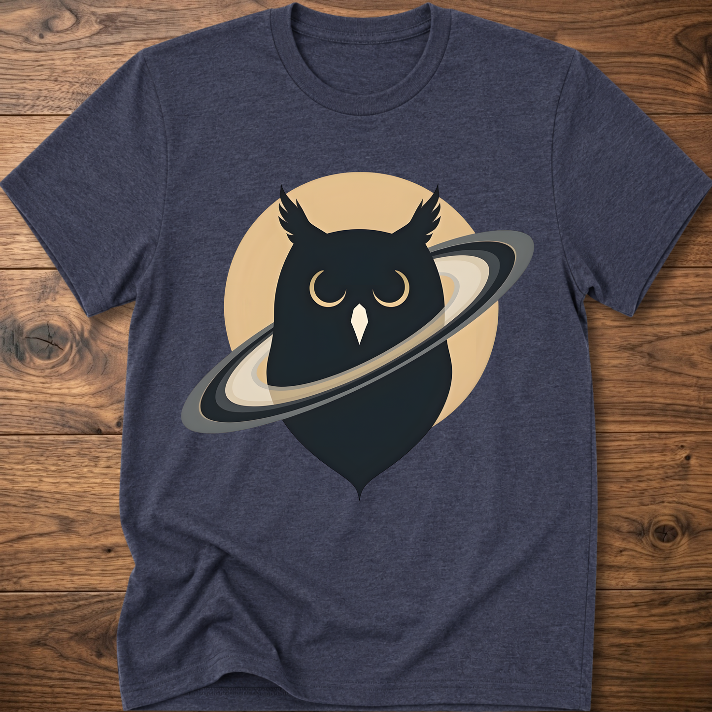 Heather blue t-shirt with black owl and planet graphic on the front