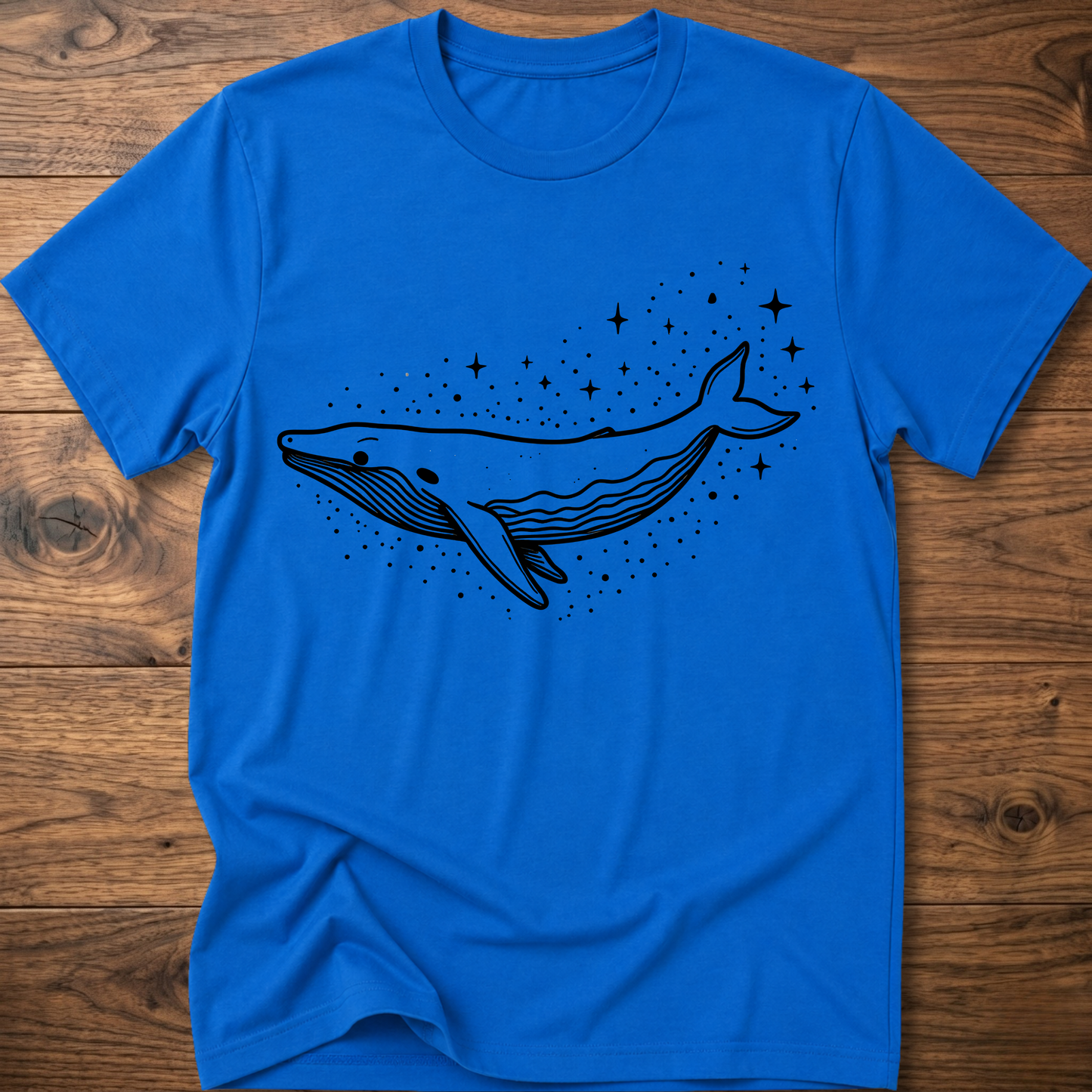 Royal blue t-shirt with minimalist whale graphic and starry dot constellation print