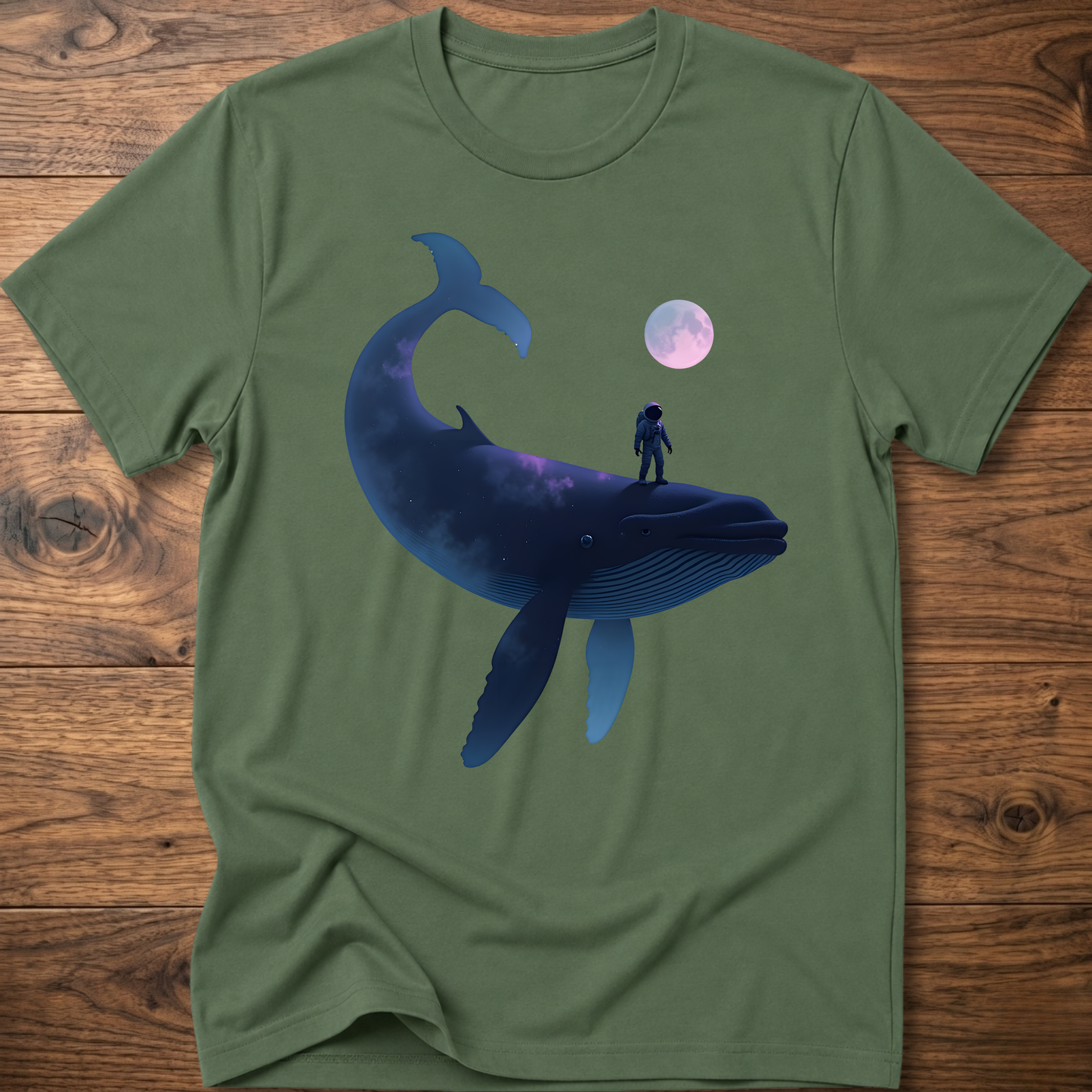 Green T-shirt with astronaut riding dark whale graphic and small planet print