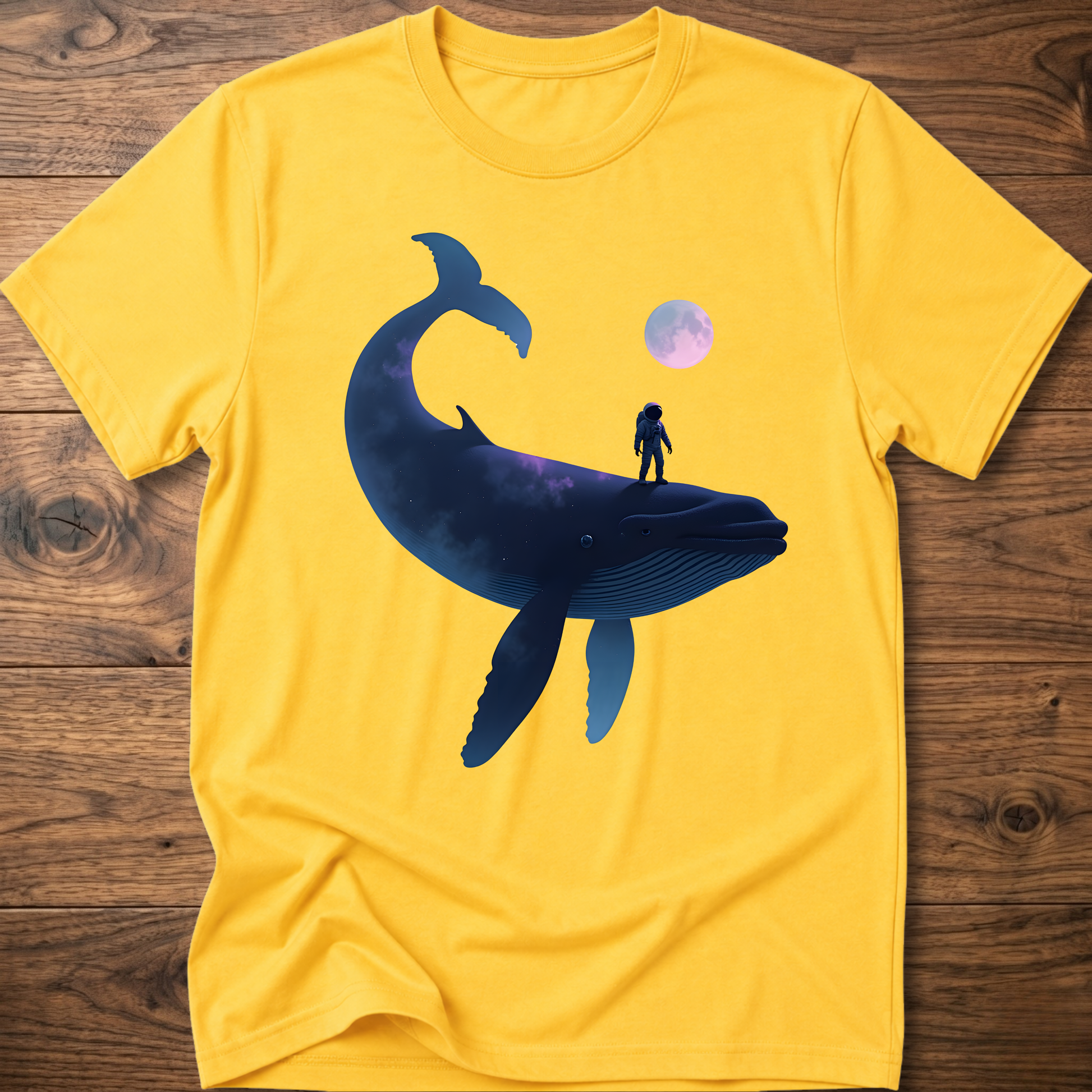 Yellow T-shirt with astronaut riding dark whale graphic and small planet print