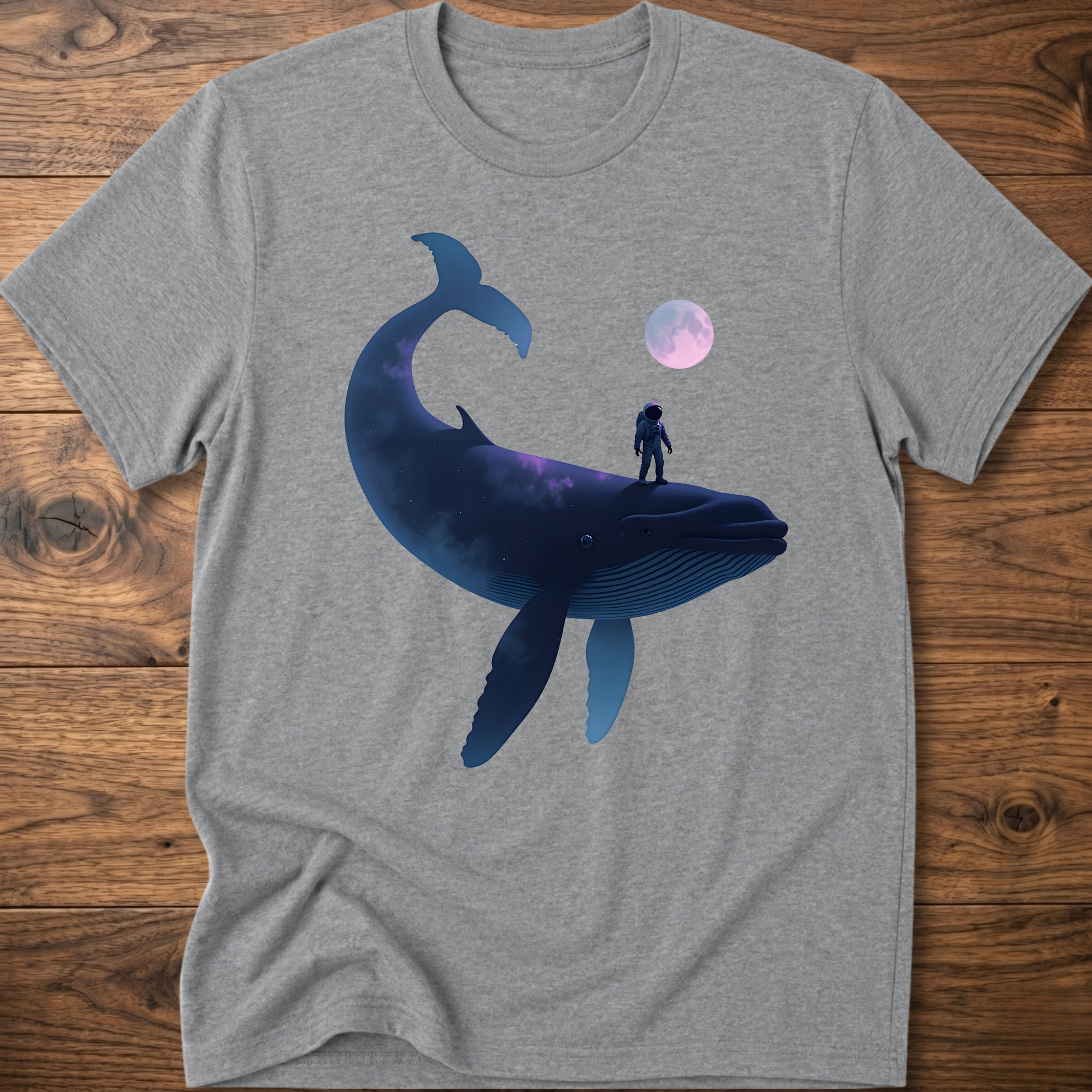 Light gray T-shirt with astronaut riding dark whale graphic and small planet print