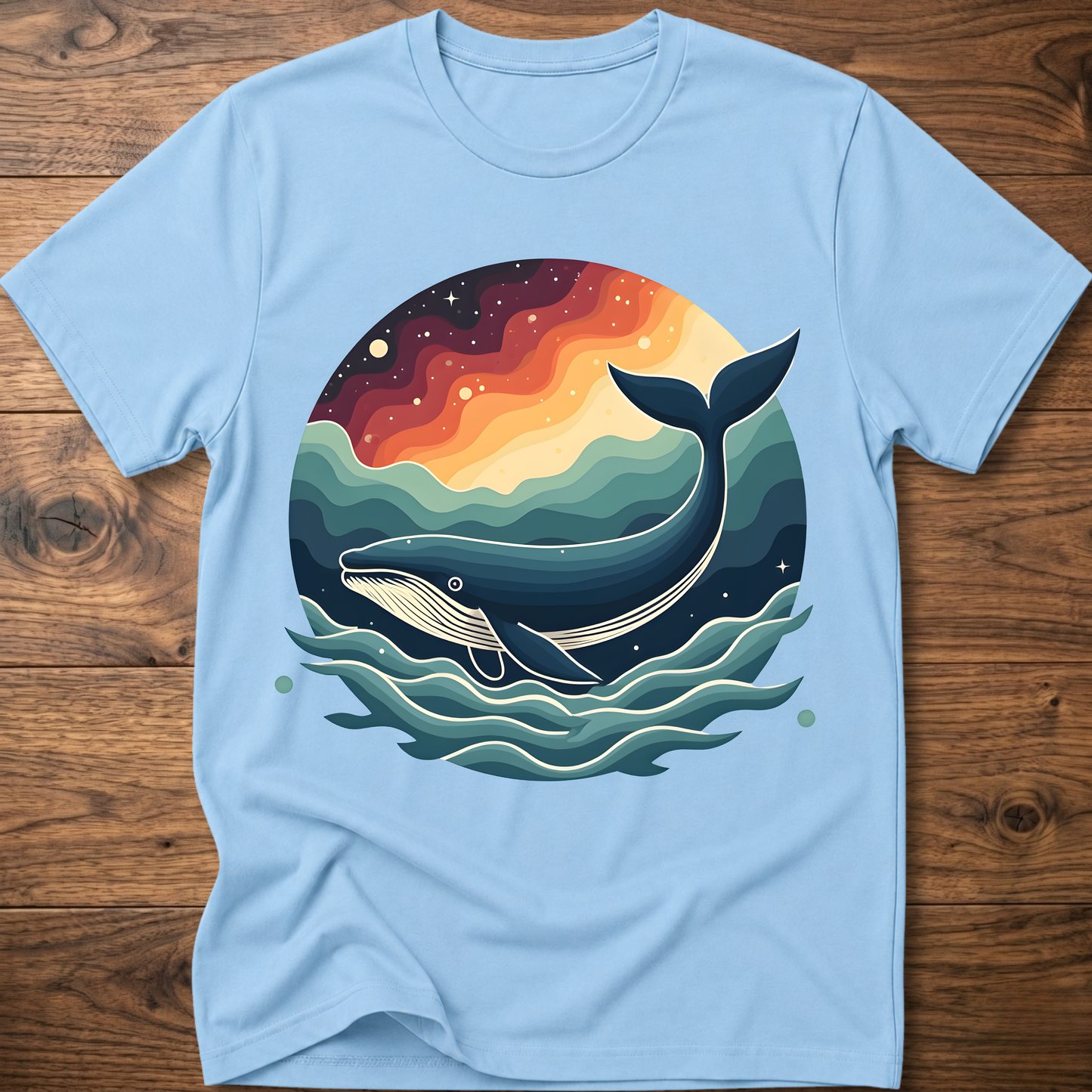 Light blue crew-neck t-shirt with retro whale graphic over colorful ocean waves