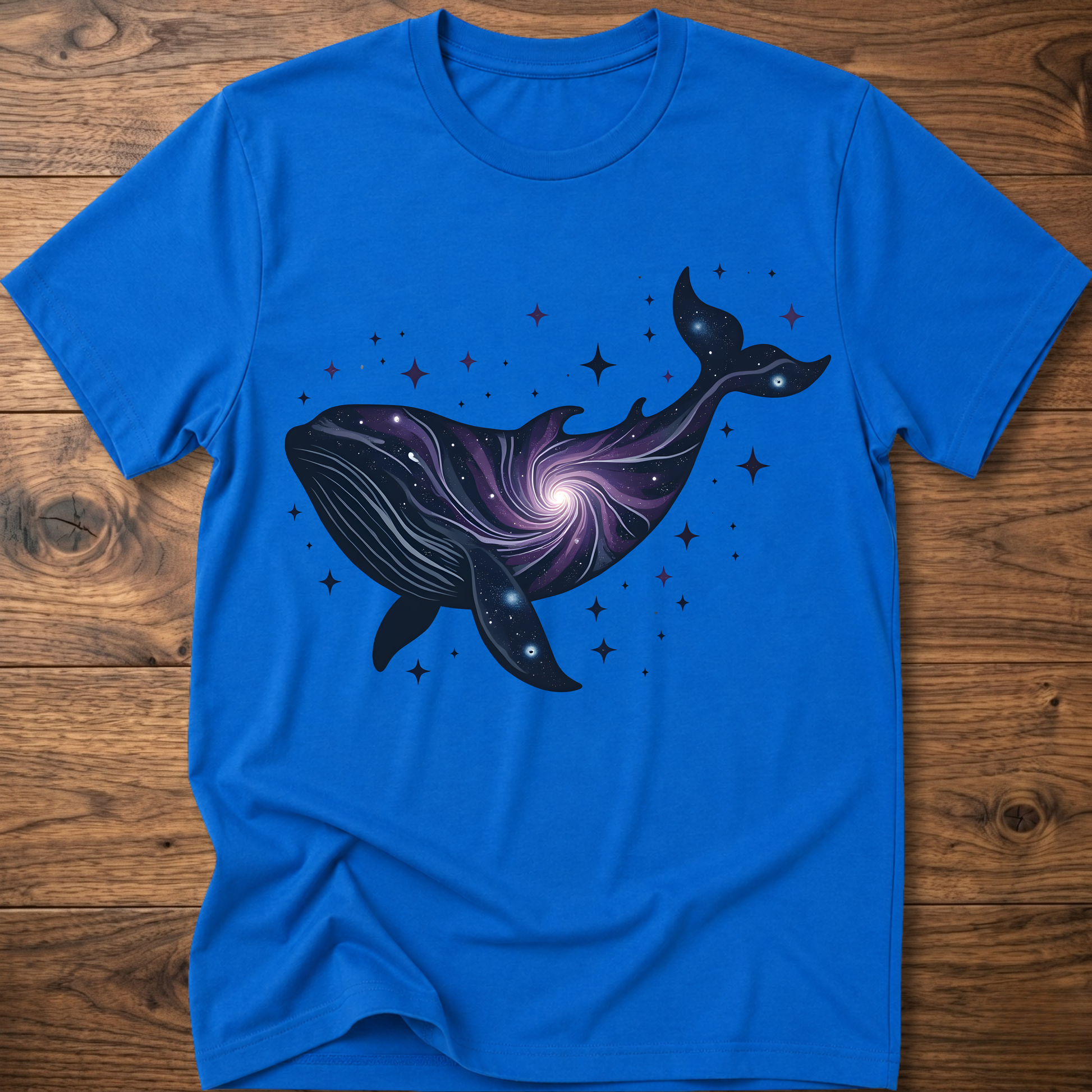 Royal blue crew-neck t-shirt with dark blue whale galaxy graphic and star dots