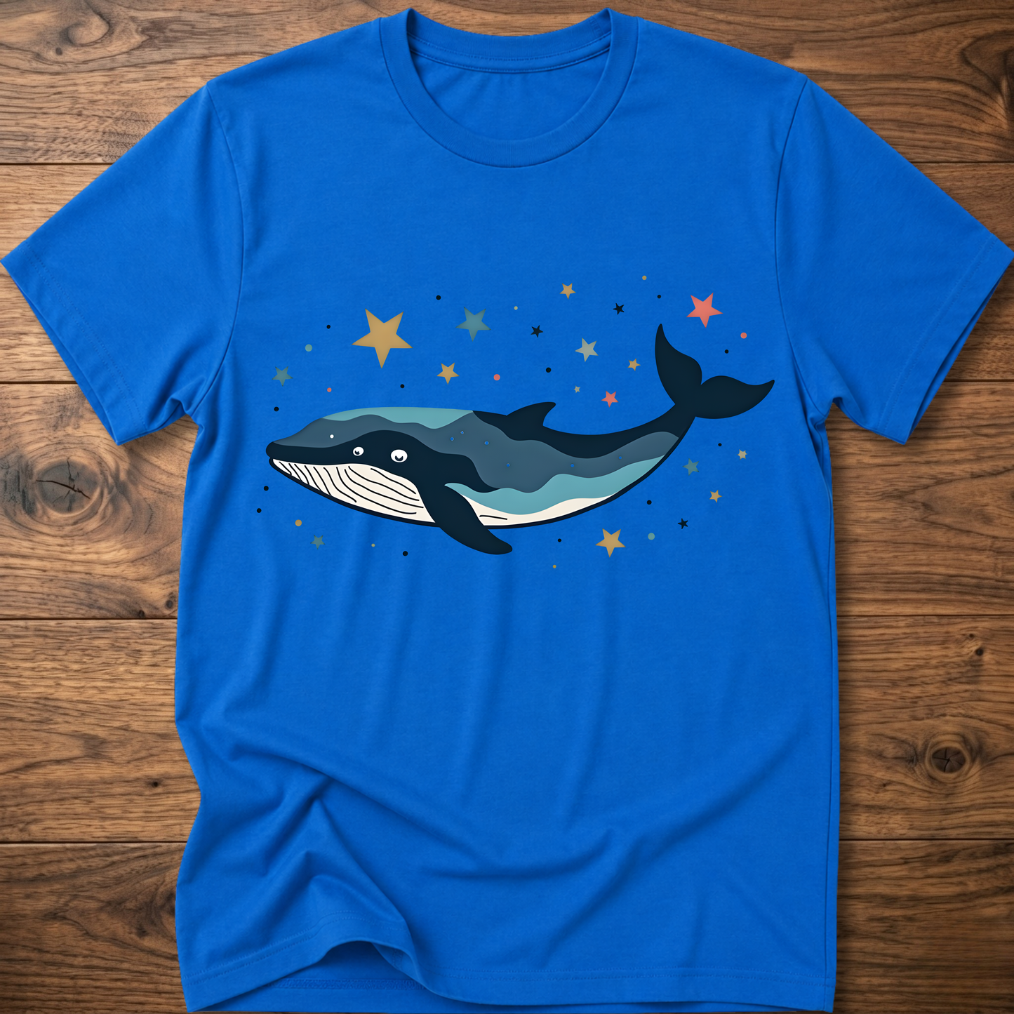 Blue whale graphic t-shirt with starry colorful constellation print