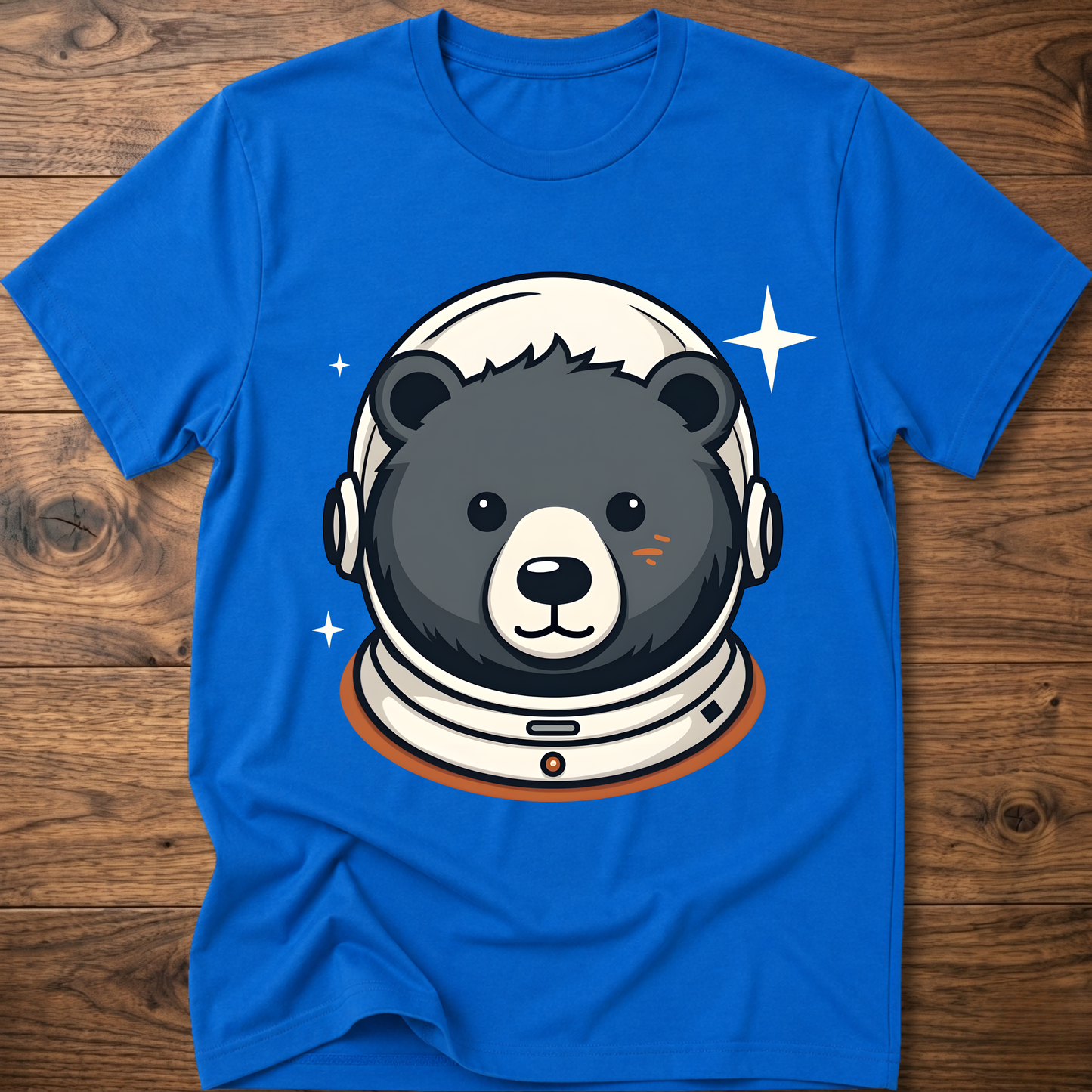 Bright blue T-shirt featuring an astronaut teddy bear head with helmet