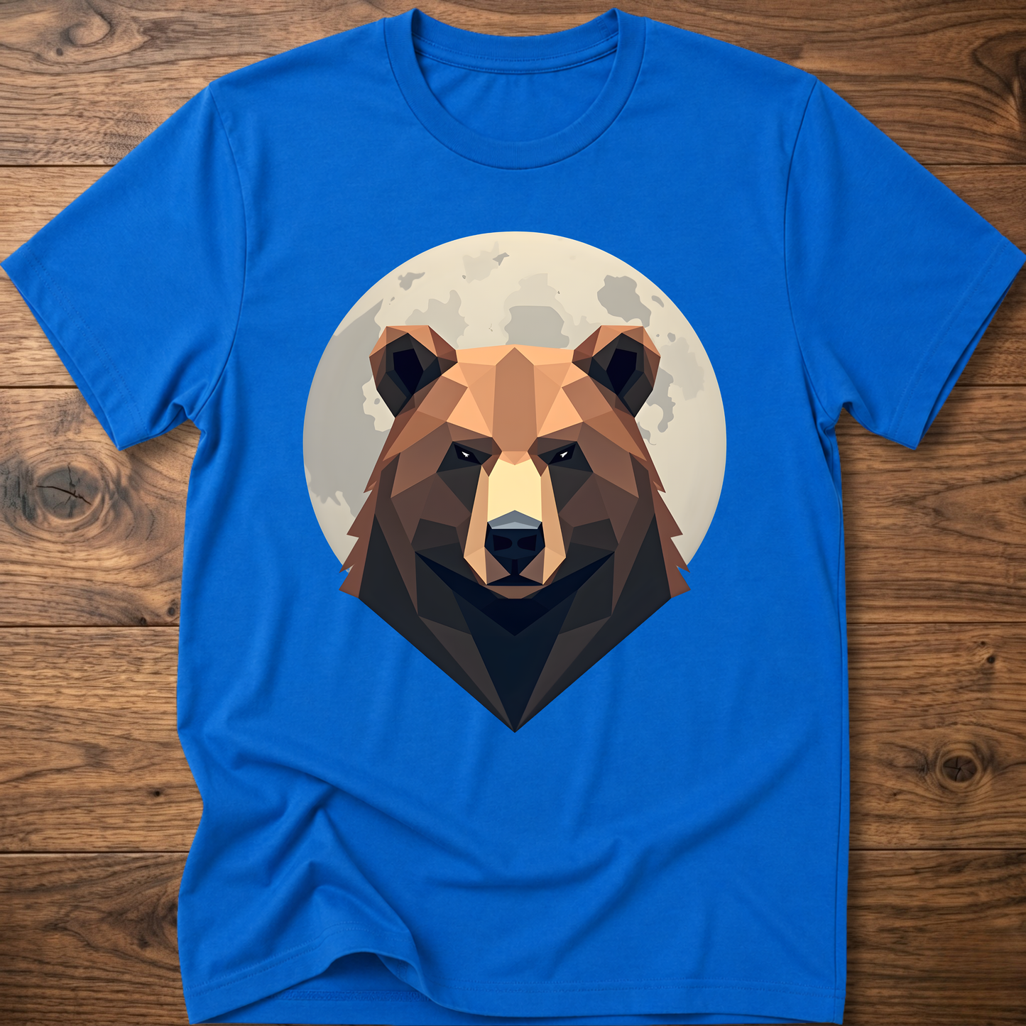 Royal blue T-shirt with centered geometric bear face graphic inside a moon-like circle.
