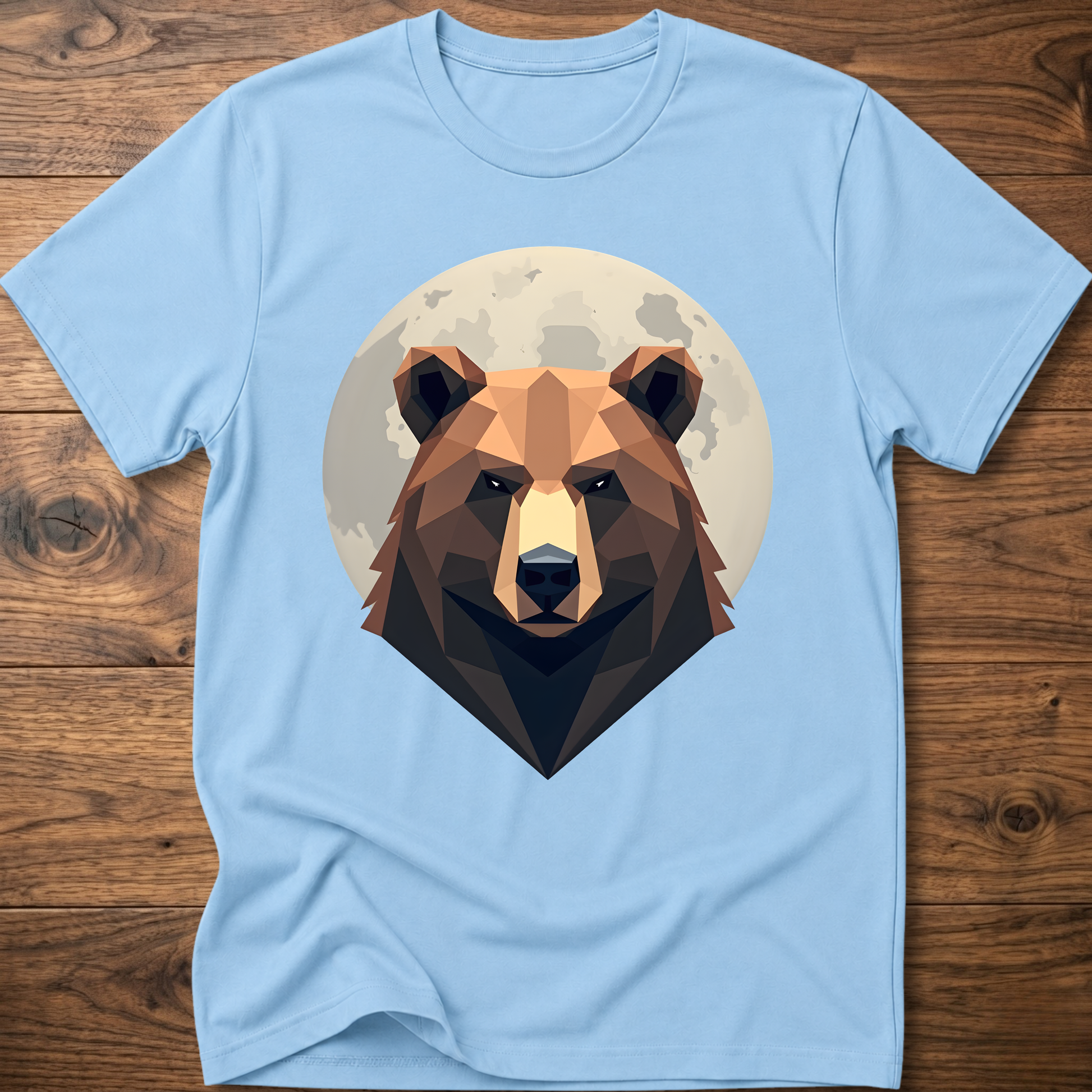 Light blue T-shirt with centered geometric bear head graphic inside a moon-like circle.