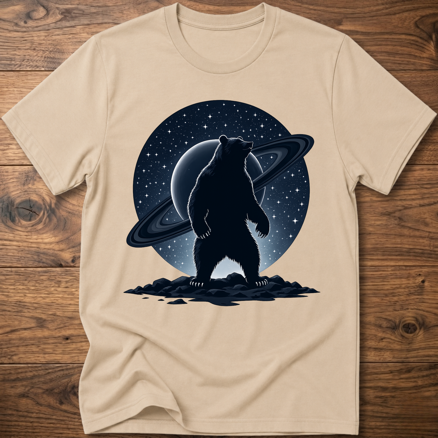 Sand/beige T-shirt with black Saturn bear graphic on the front