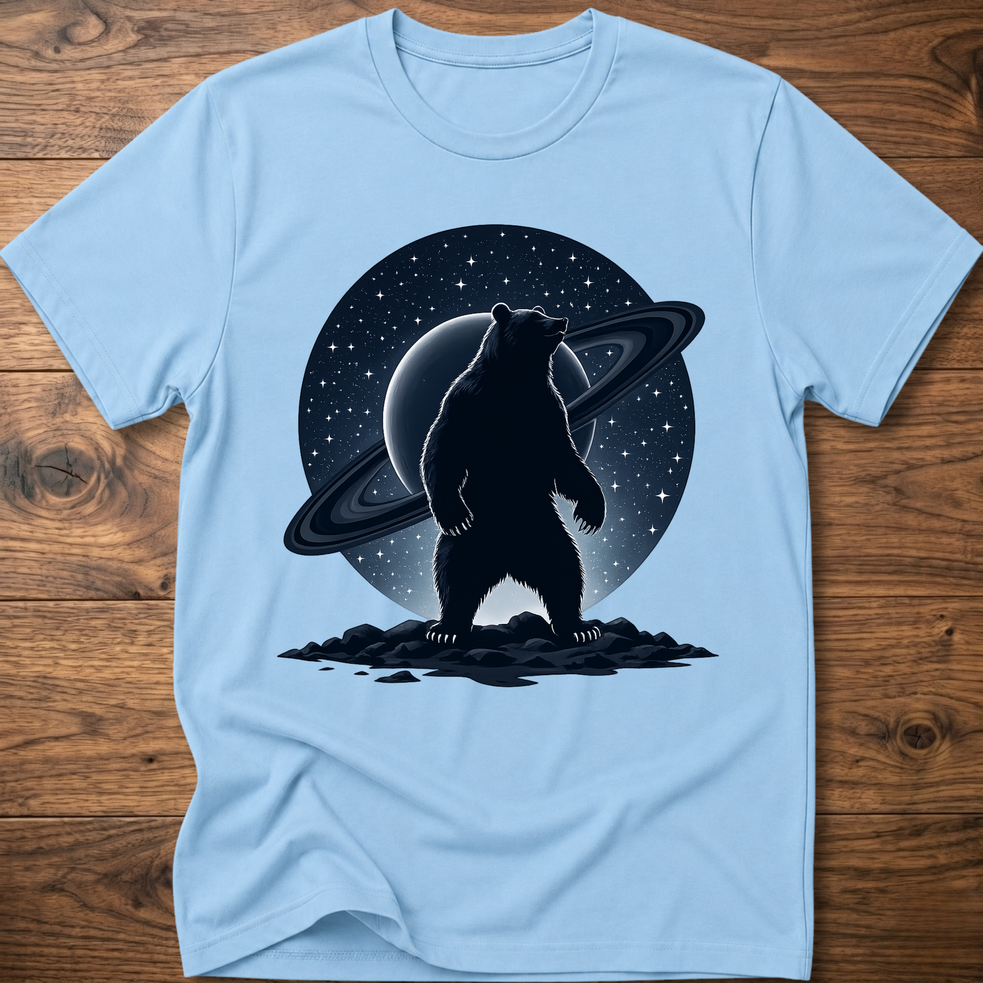 Light blue T-shirt with black Saturn bear graphic on the front