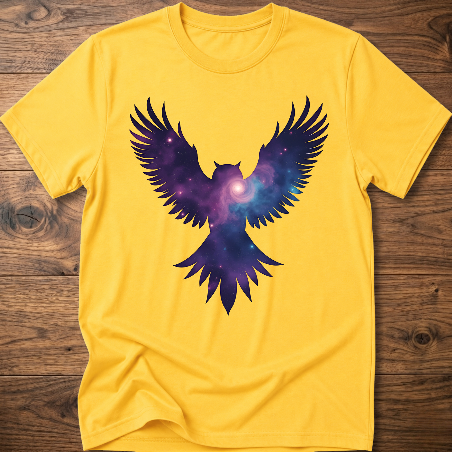 Mustard yellow crew-neck T-shirt with galaxy owl wings graphic in purple and blue