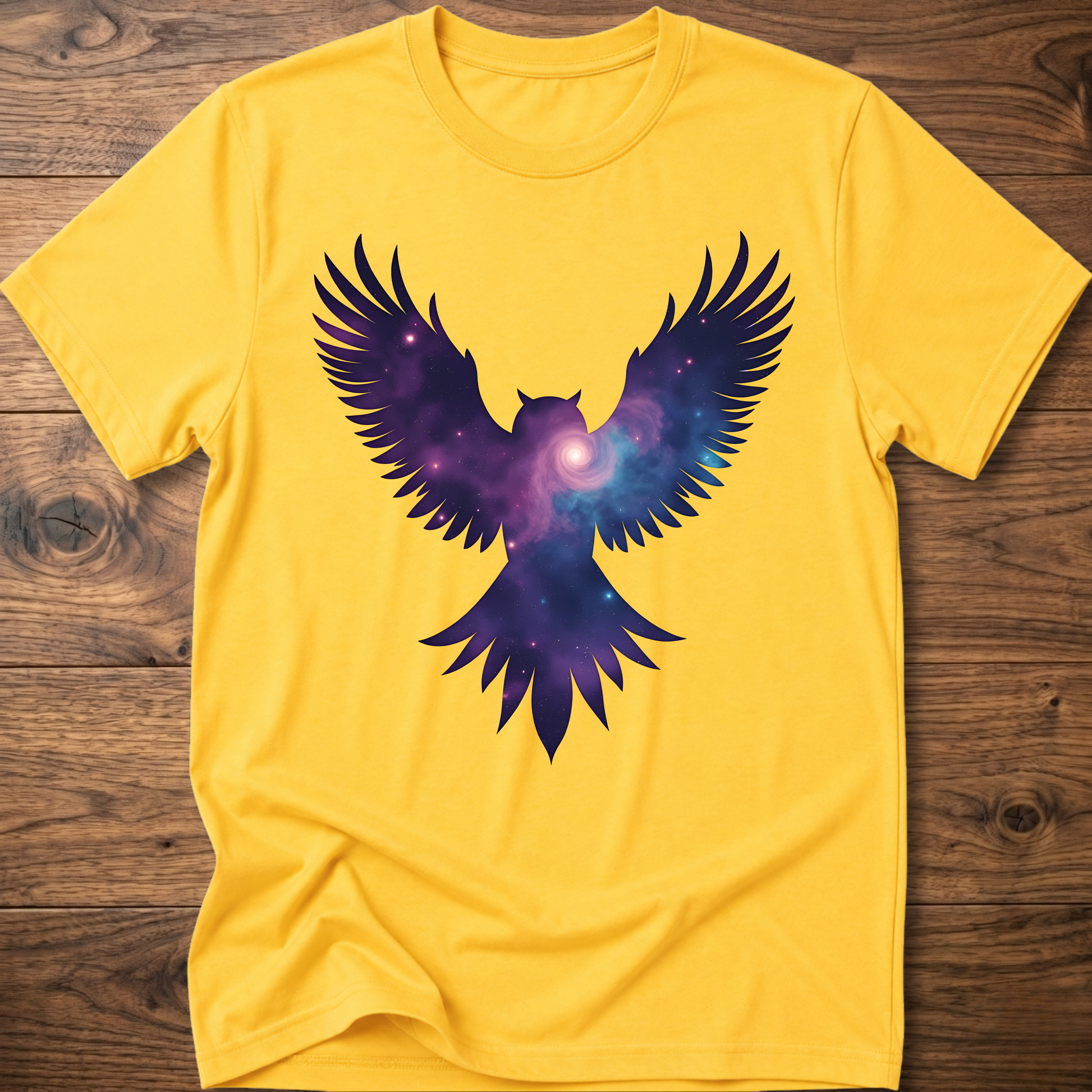 Mustard yellow crew-neck T-shirt with galaxy owl wings graphic in purple and blue