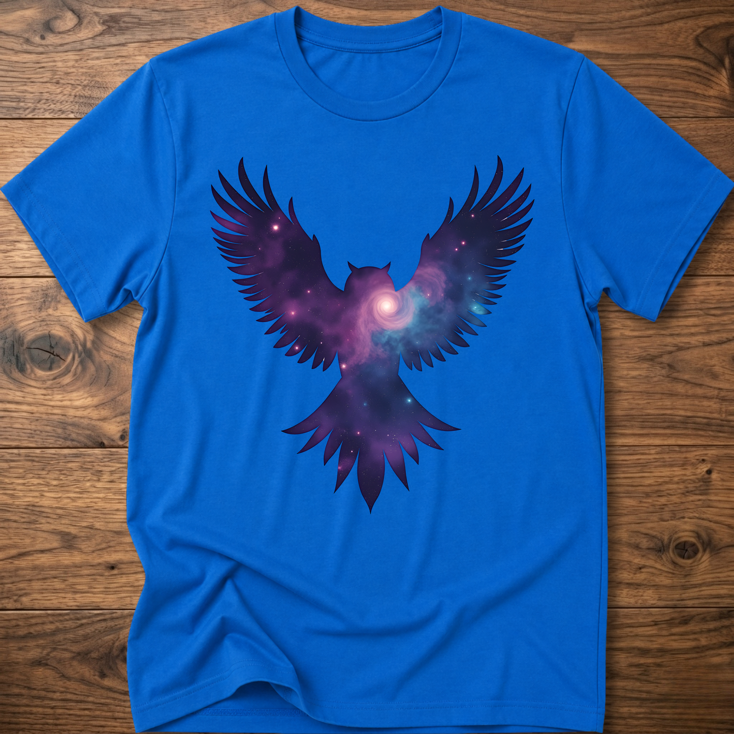Royal blue crew-neck T-shirt with galaxy owl wings graphic in purple and blue