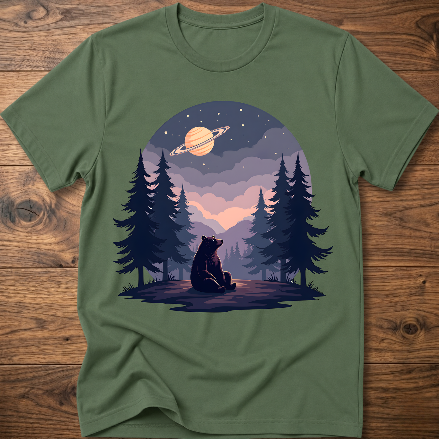 Dark green t-shirt with night sky bear graphic, ringed planet and pine trees