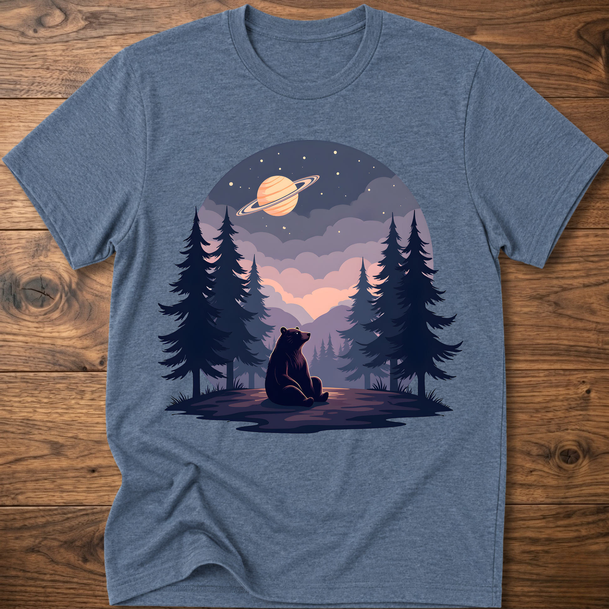 Blue-gray t-shirt with night sky bear graphic, ringed planet and pine trees