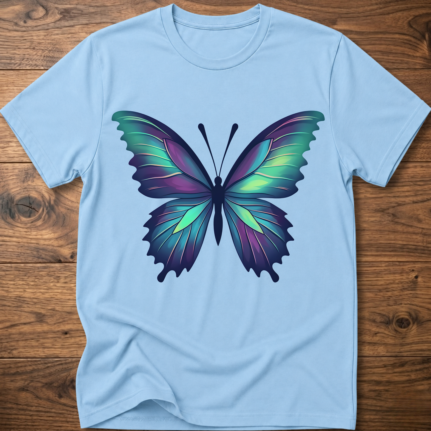 Light blue t-shirt with colorful geometric butterfly graphic on the chest