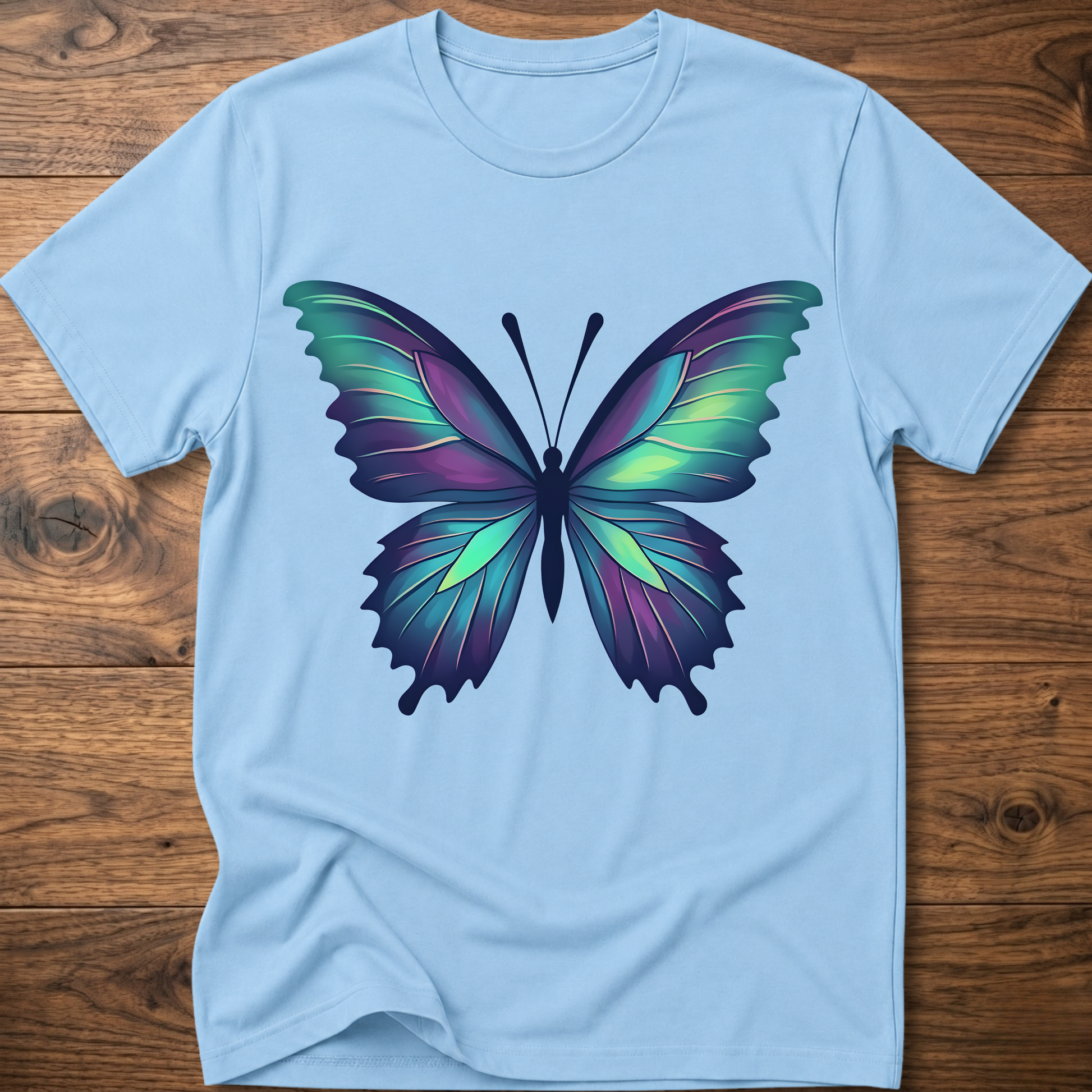 Light blue t-shirt with colorful geometric butterfly graphic on the chest