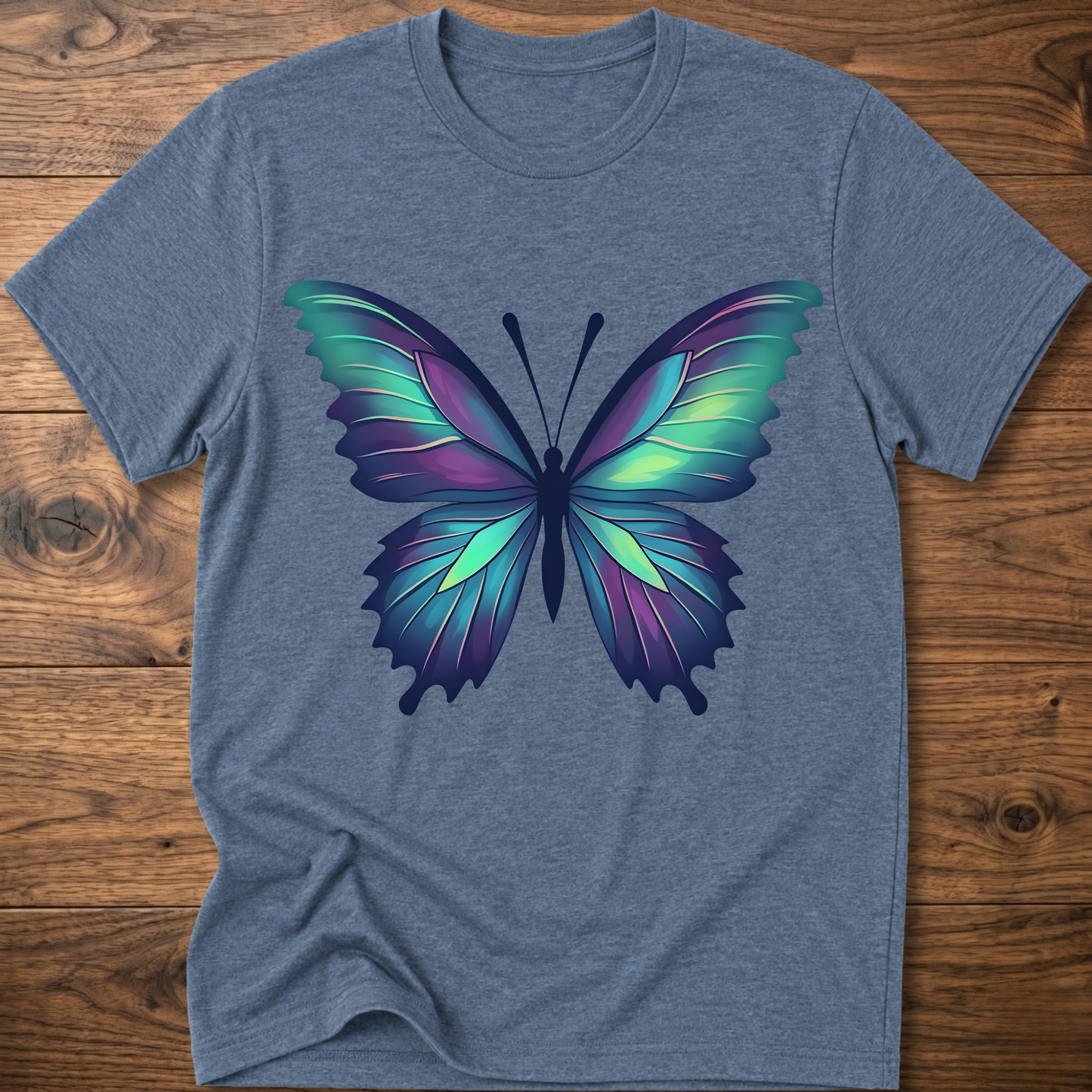 Heather blue t-shirt with colorful geometric butterfly graphic on the chest