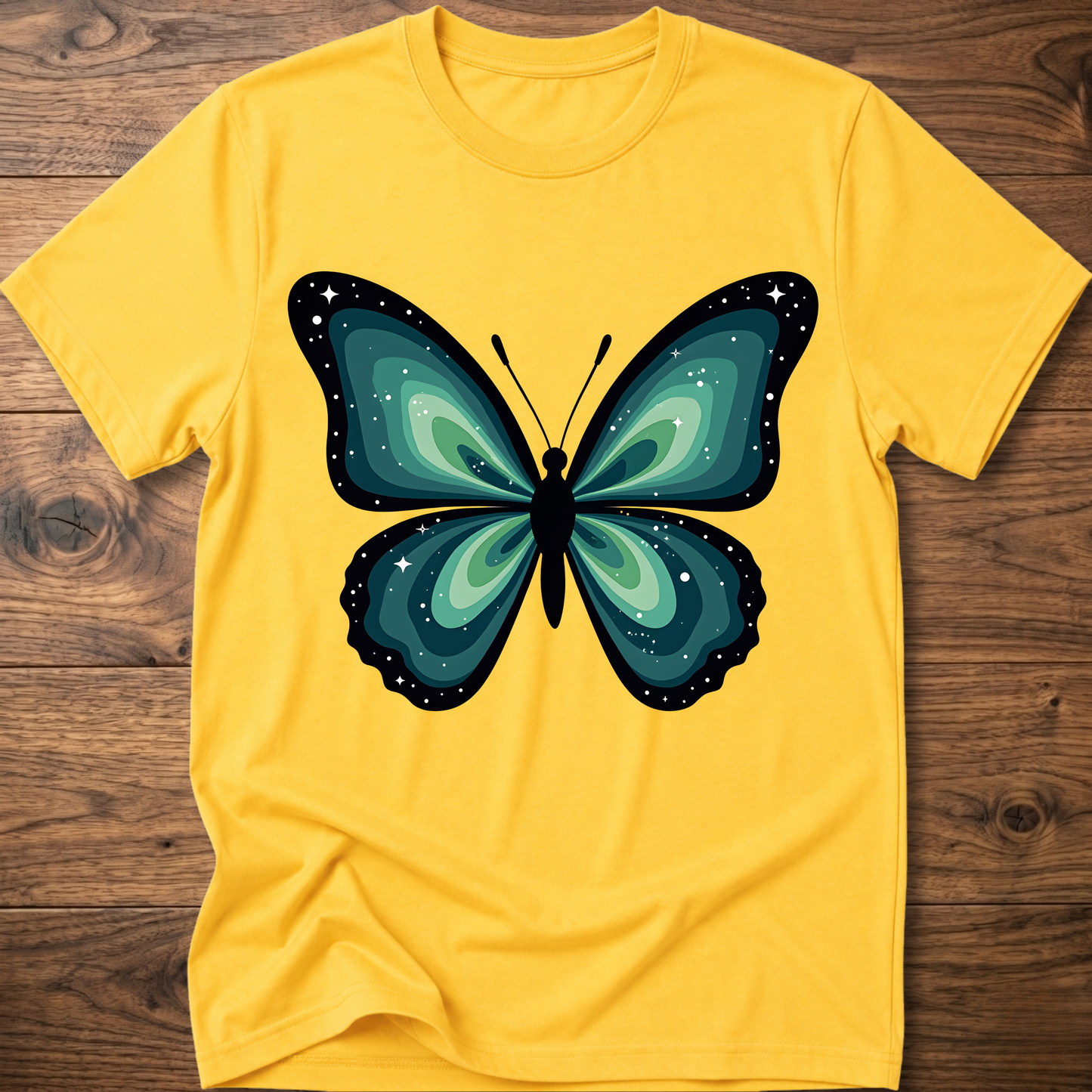 Yellow t-shirt with teal butterfly graphic in navy outline, crew neck.