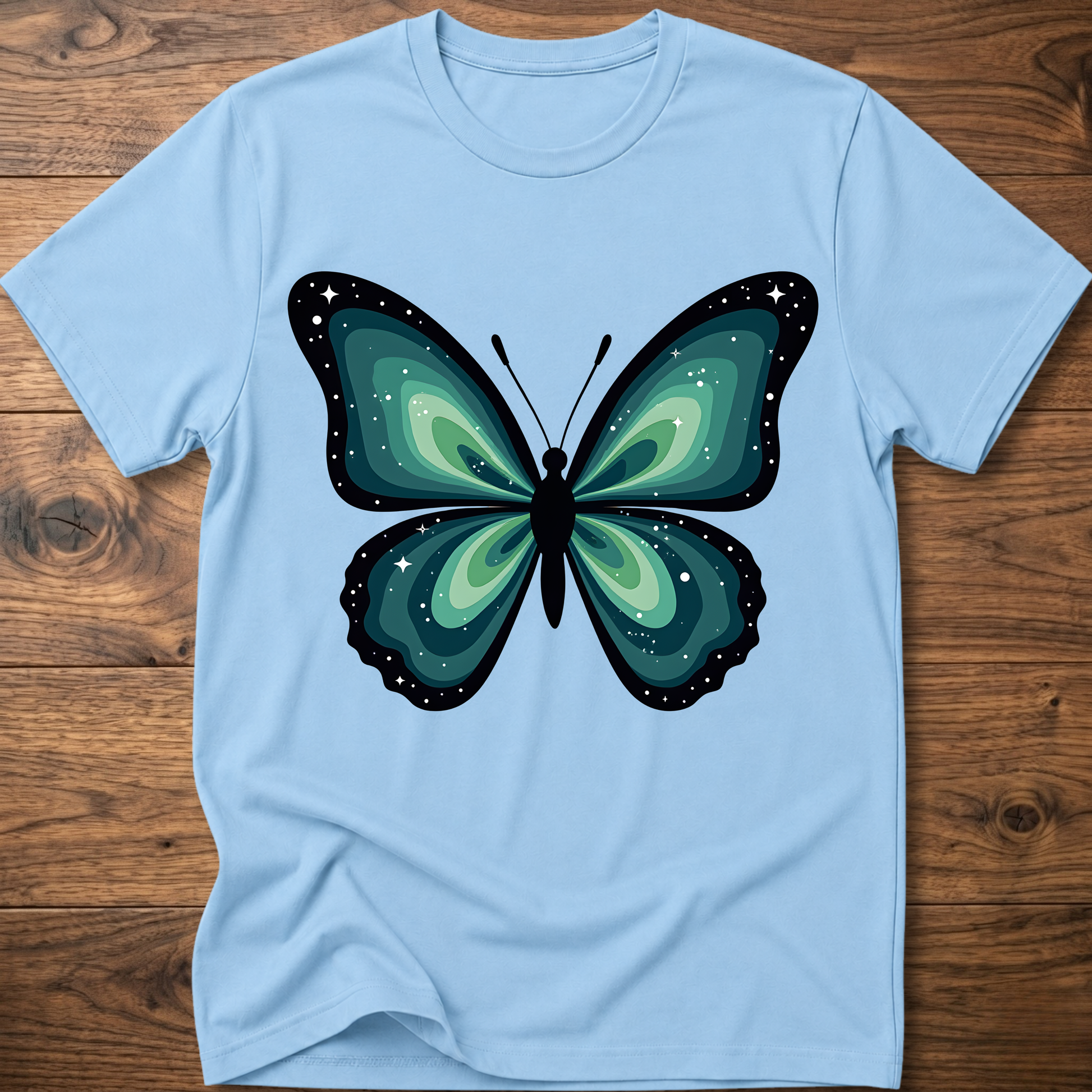 Light blue T-shirt with large teal butterfly graphic on front