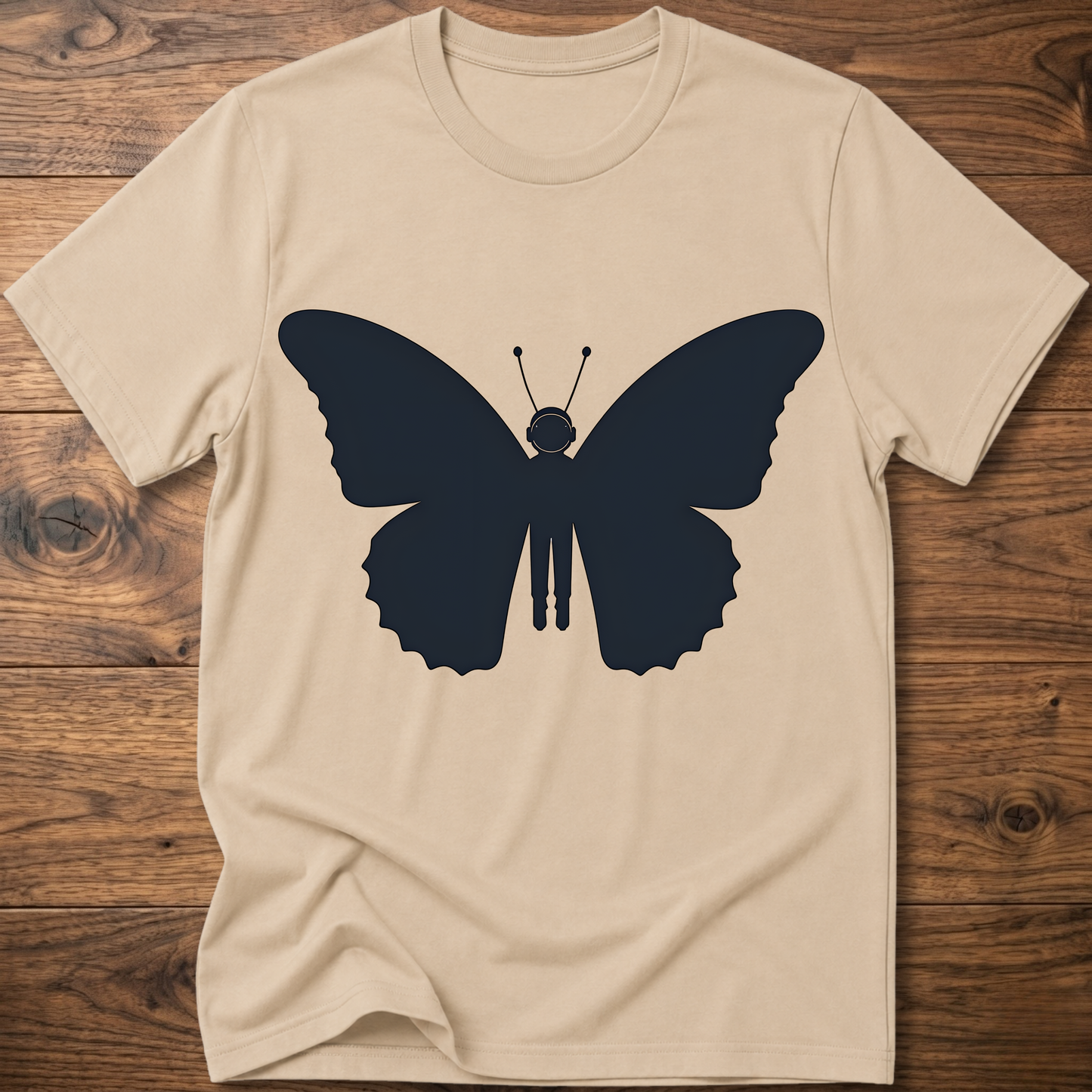 Sand crewneck T-shirt with dark blue astronaut butterfly graphic on the front