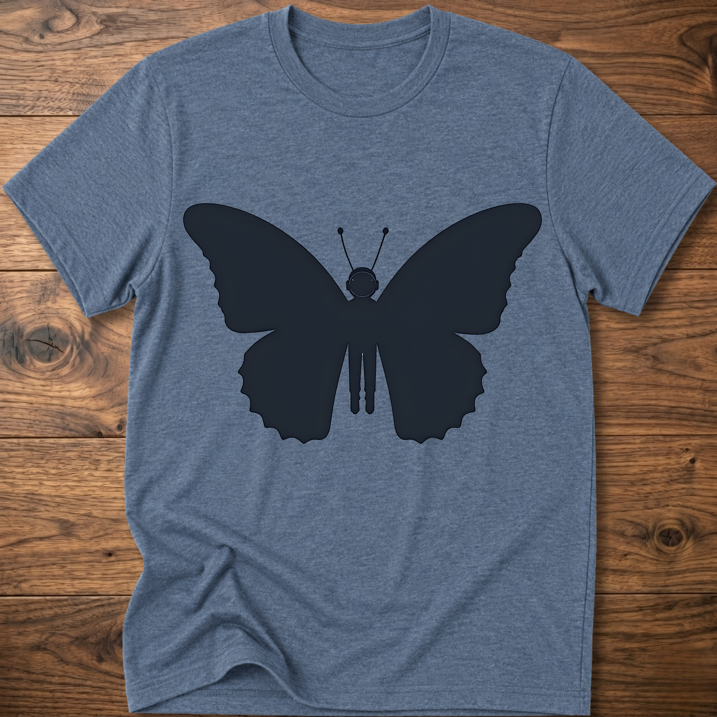 Heather blue crewneck T-shirt with dark blue astronaut butterfly graphic on the front